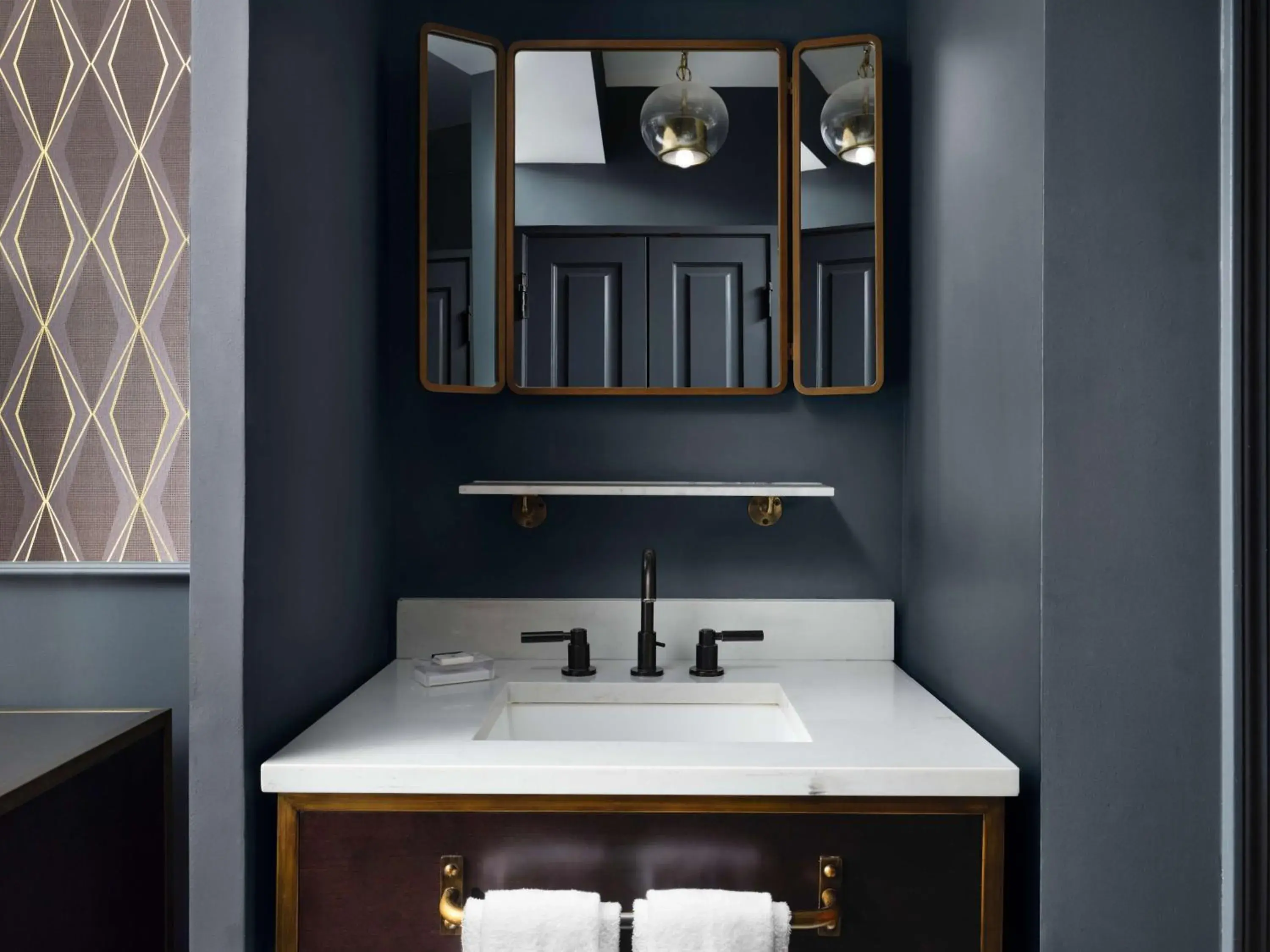 Bathroom in Hotel Phillips Kansas City, Curio Collection By Hilton Bathroom in Hotel Phillips Kansas City, Curio Collection By Hilton