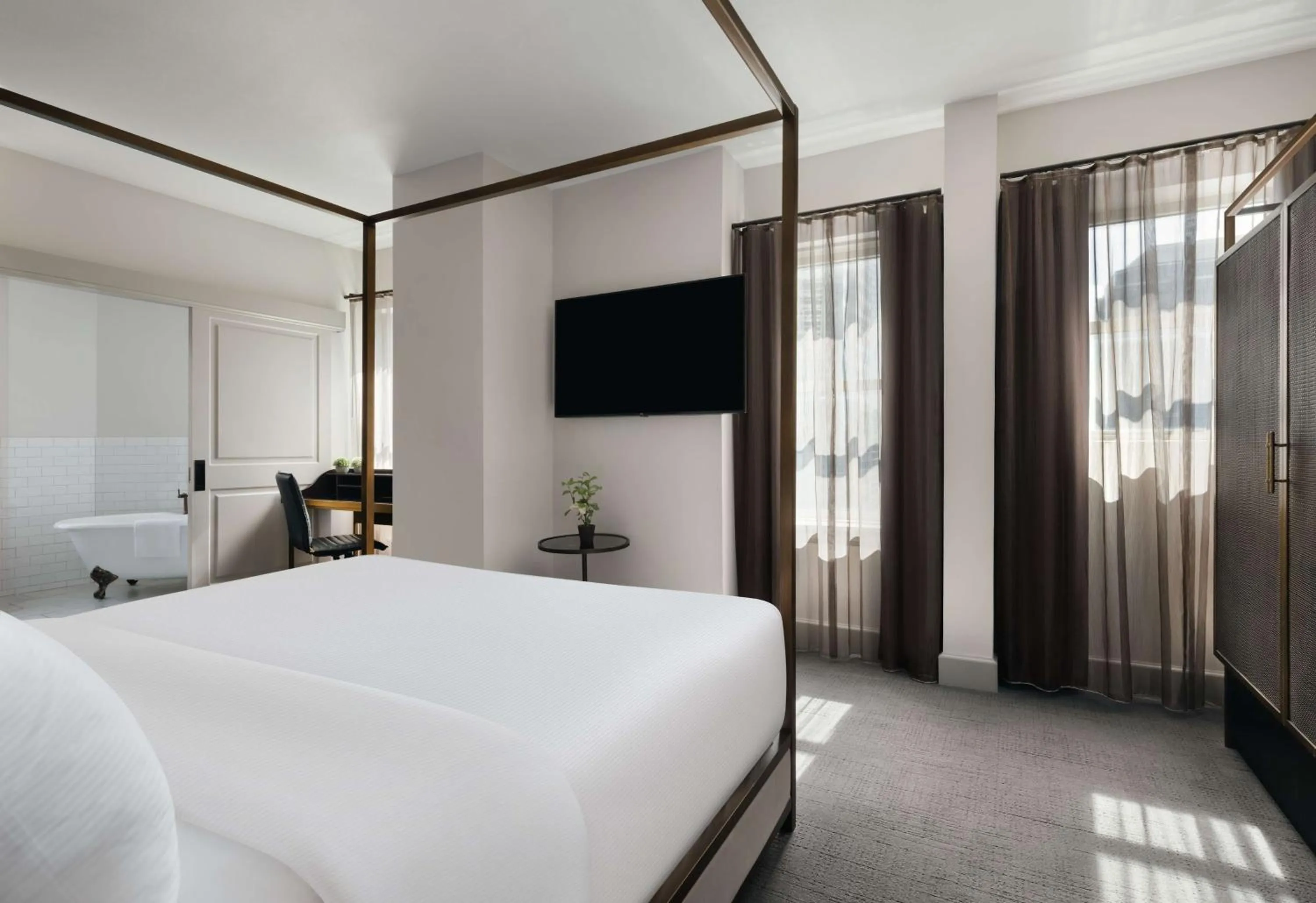 Bed in Hotel Phillips Kansas City, Curio Collection By Hilton