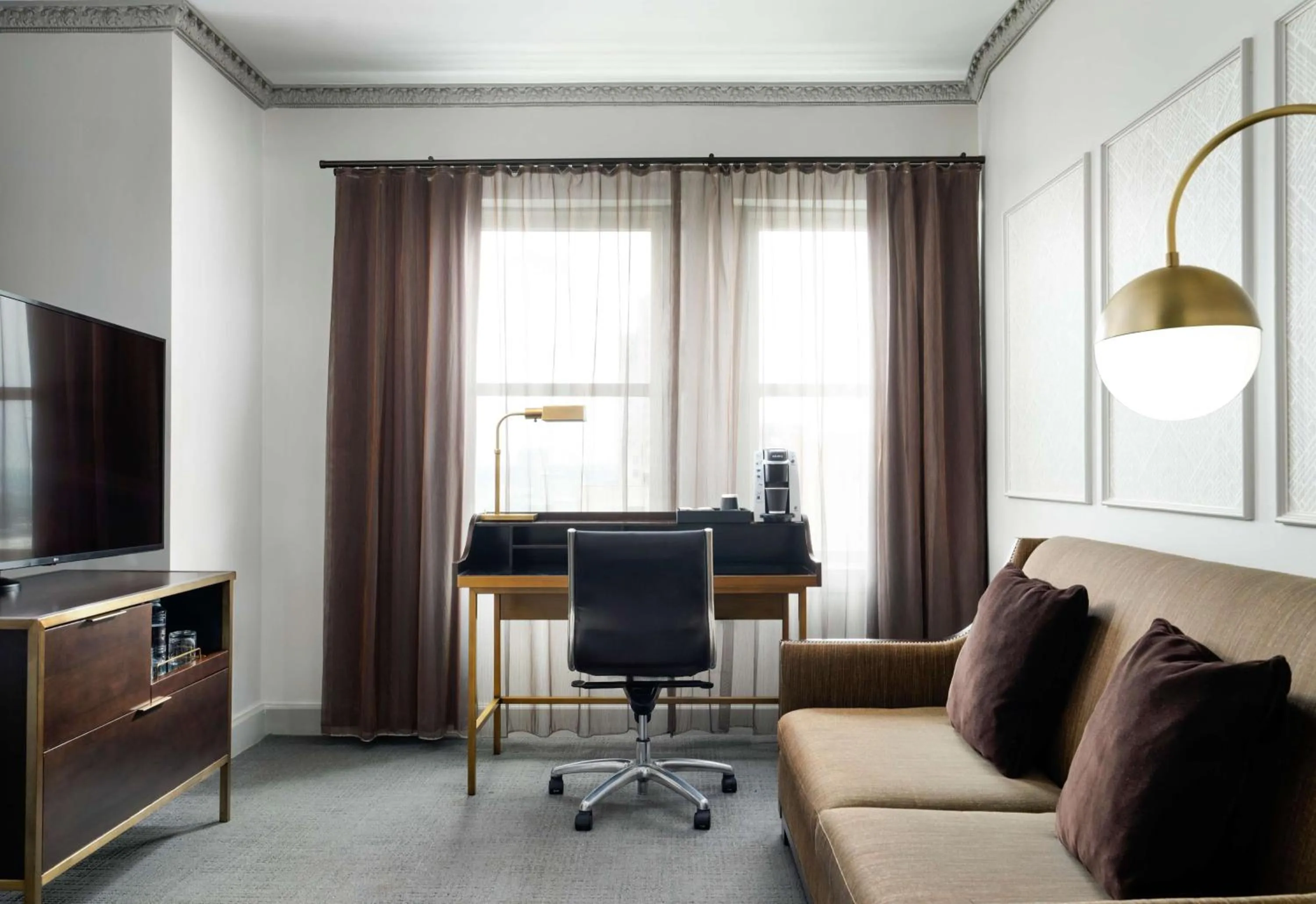 Living room in Hotel Phillips Kansas City, Curio Collection By Hilton