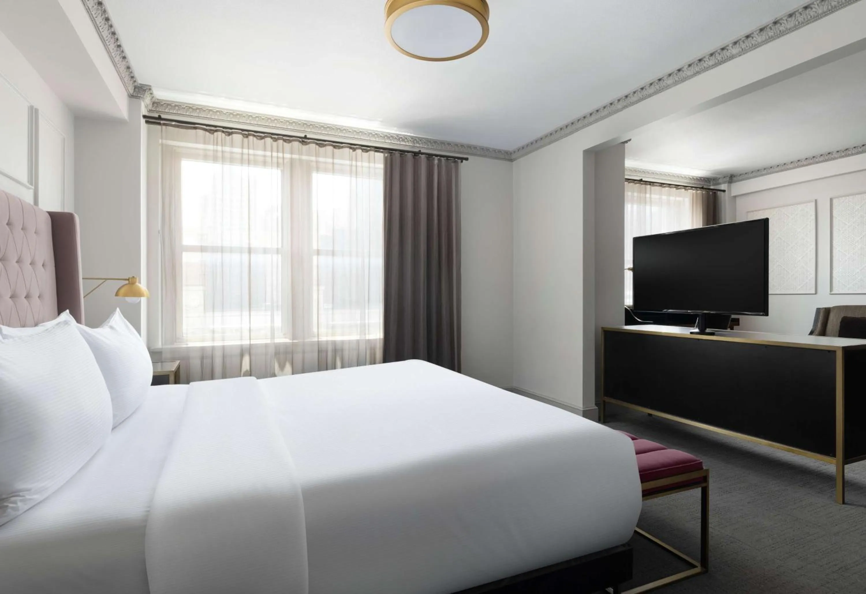 Bed in Hotel Phillips Kansas City, Curio Collection By Hilton