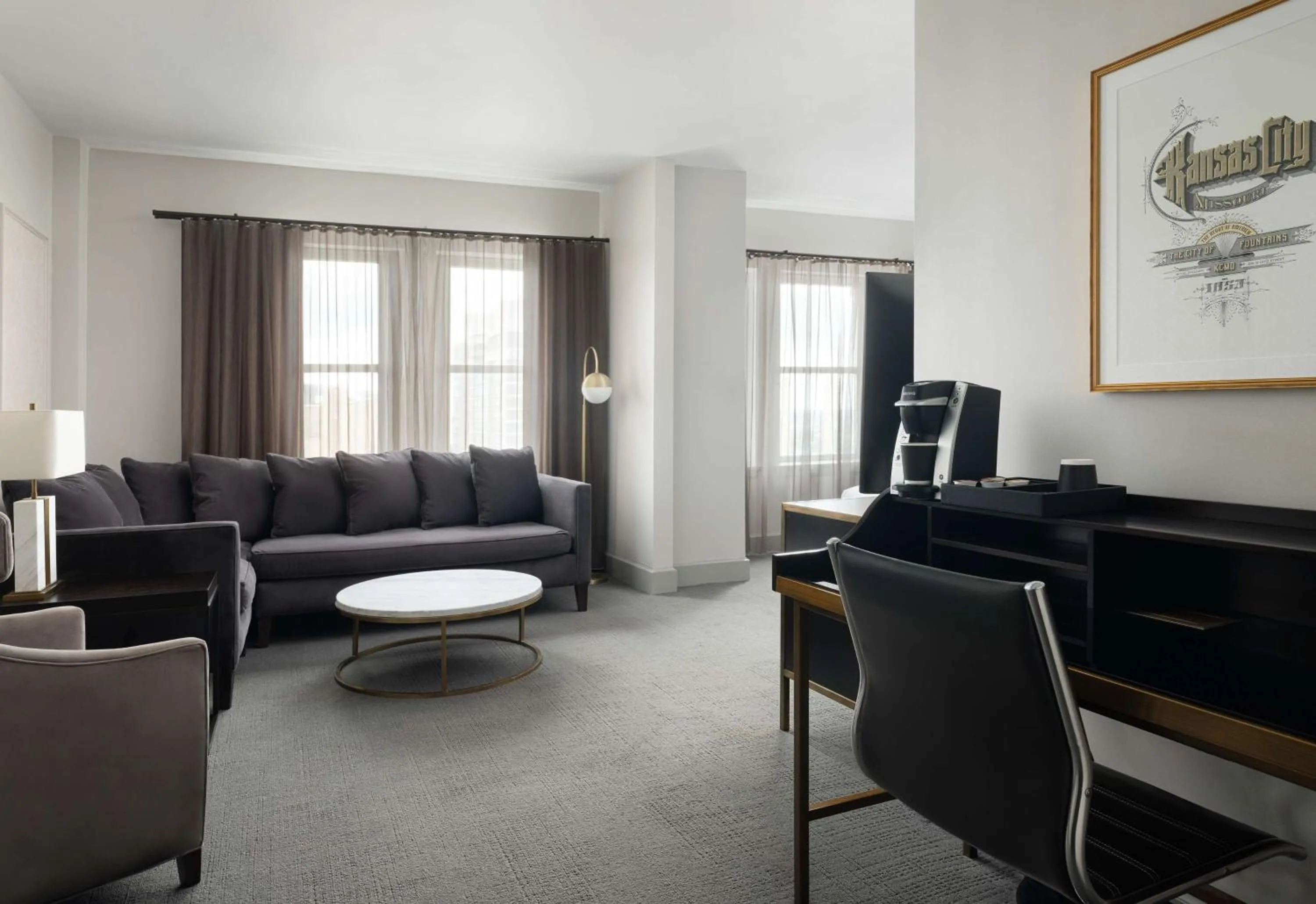 Living room in Hotel Phillips Kansas City, Curio Collection By Hilton