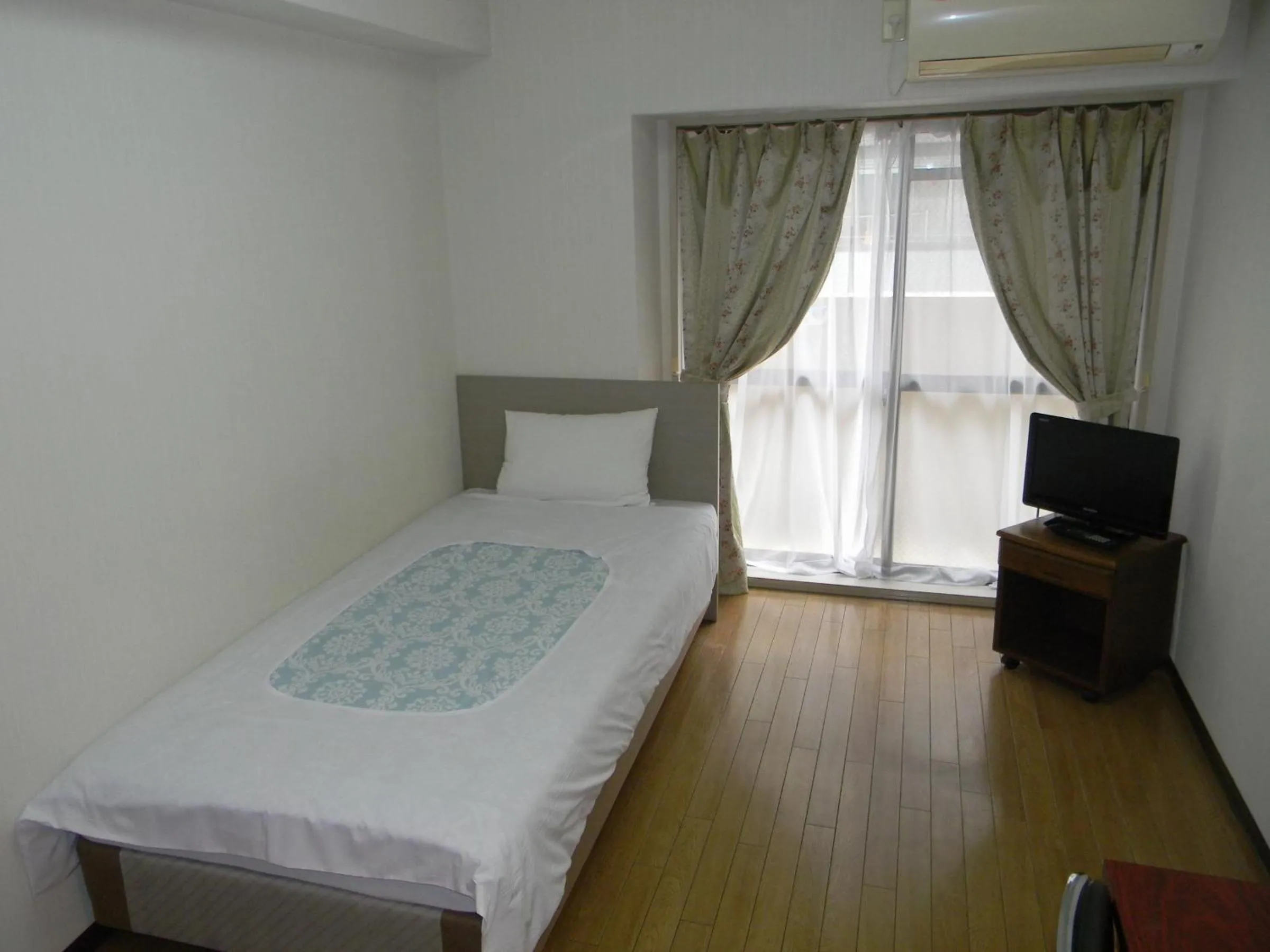 Photo of the whole room, Bed in Weekly Green In Namba