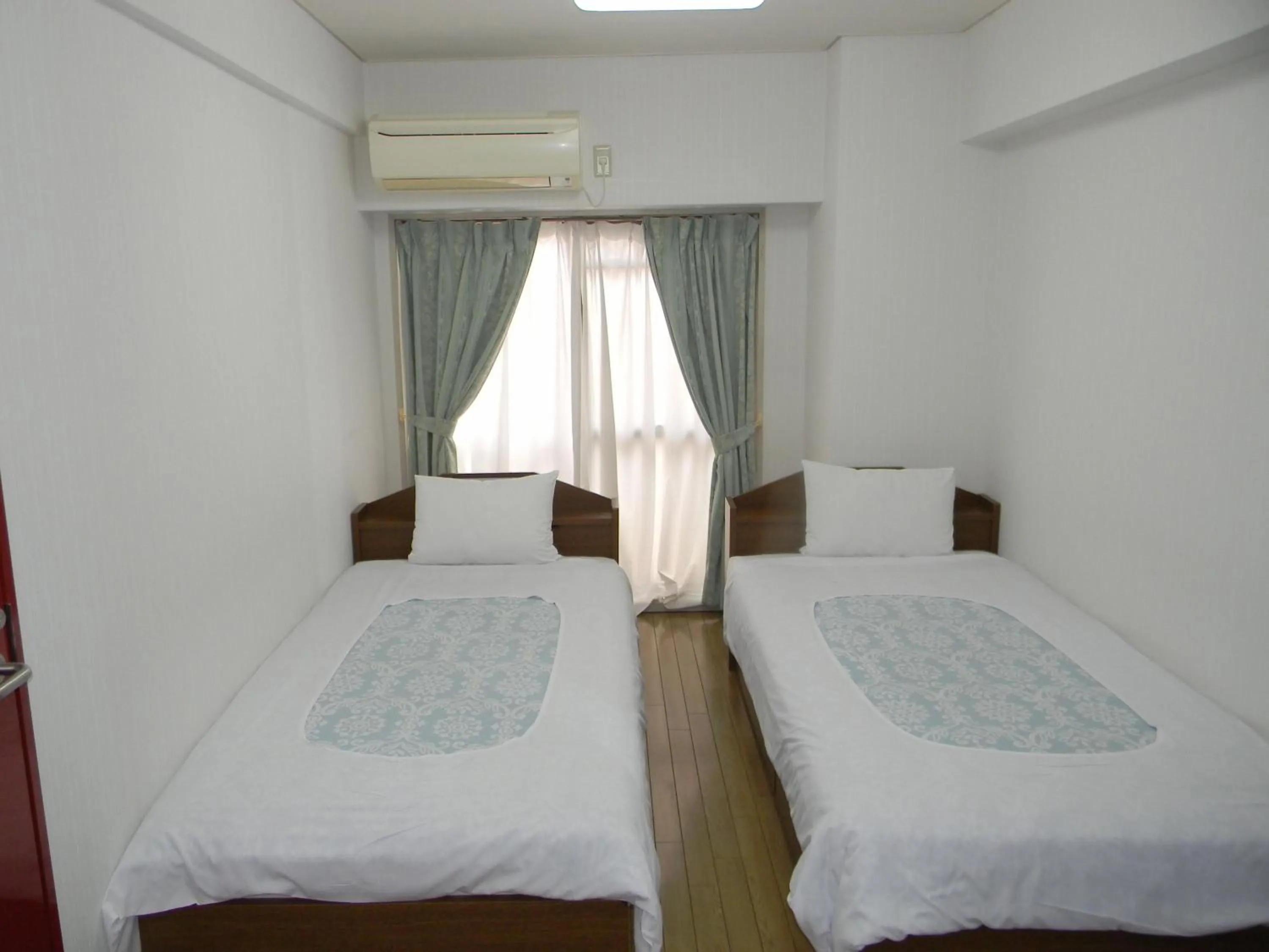 Photo of the whole room, Bed in Weekly Green In Namba