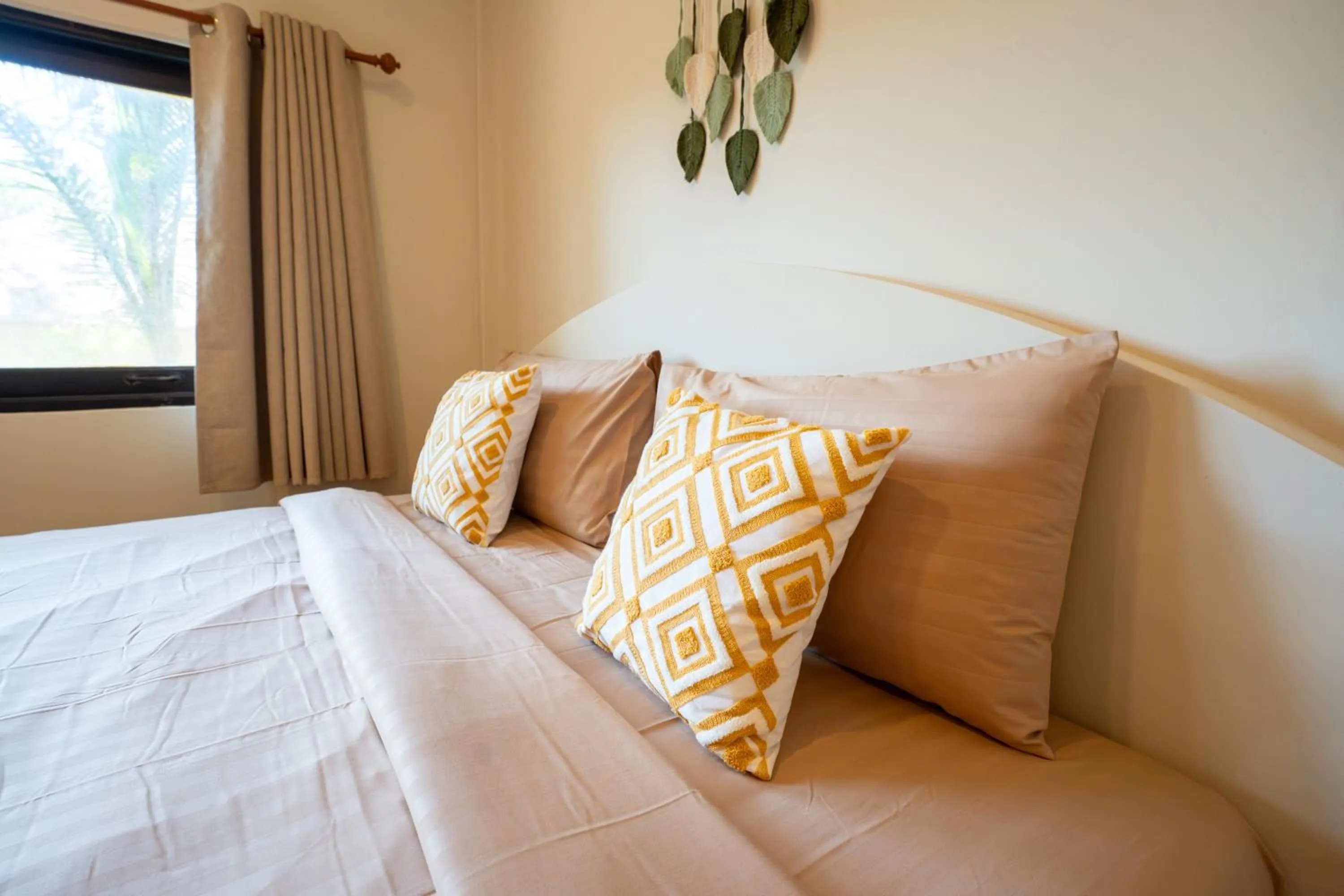 Bed in Relax Bay Beach Resort