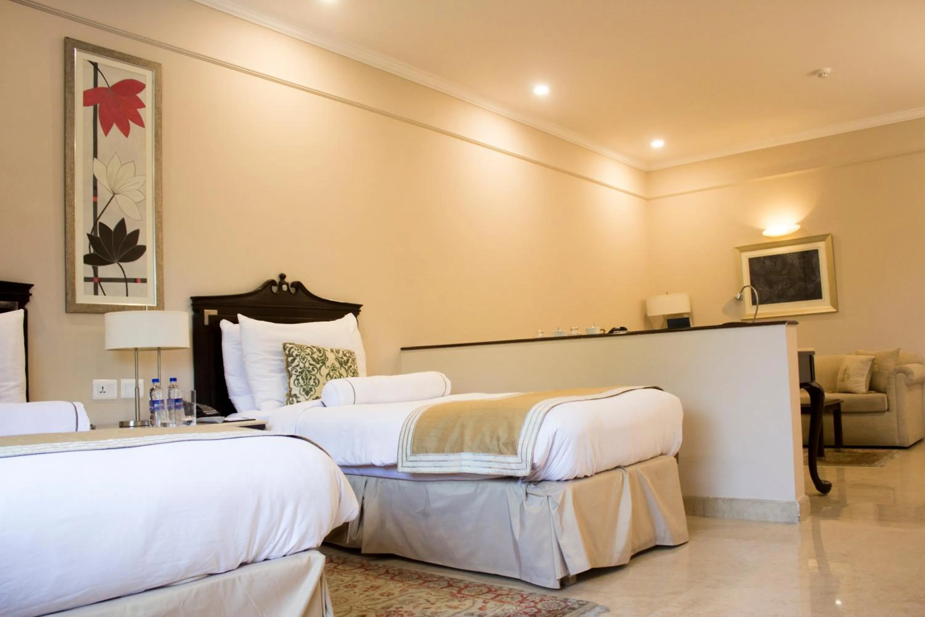 Seating area, Bed in The Claridges New Delhi