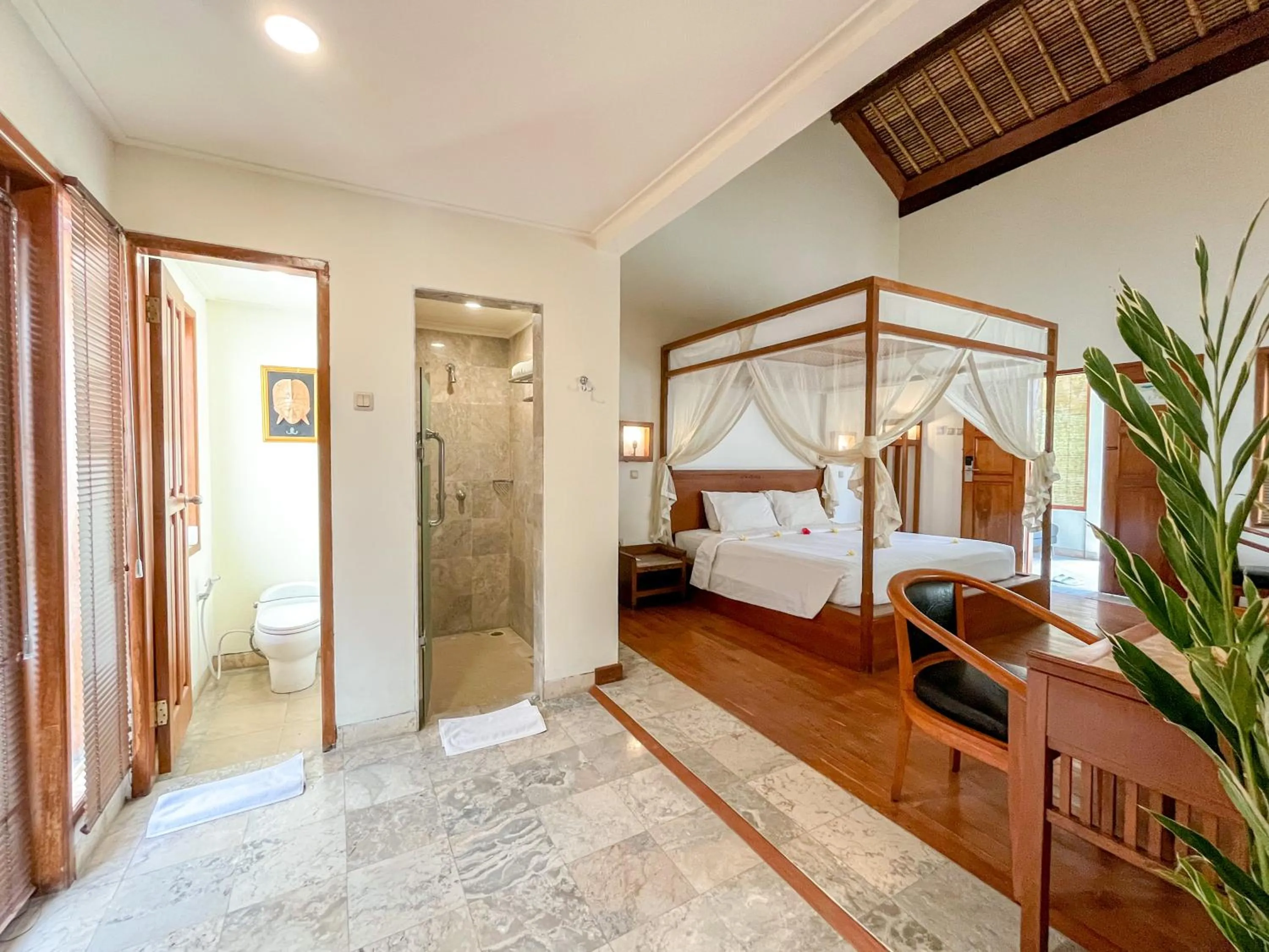 Bed in The Lagoon Bali Pool Hotel and Suites