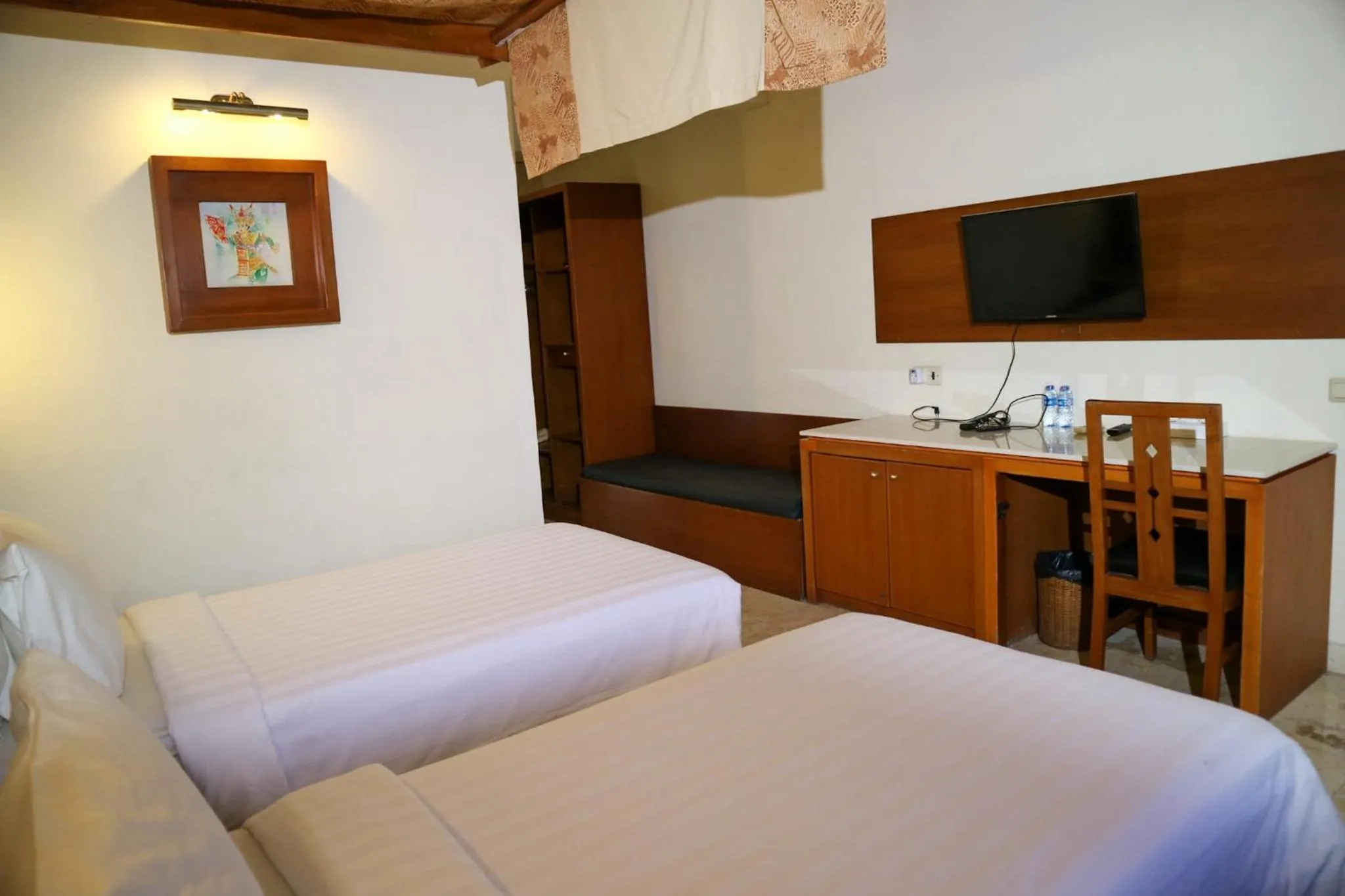 Bed in The Lagoon Bali Pool Hotel and Suites