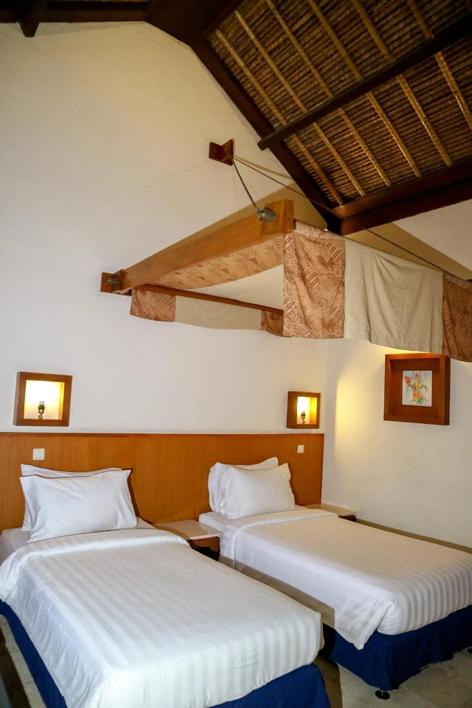 Bed in The Lagoon Bali Pool Hotel and Suites