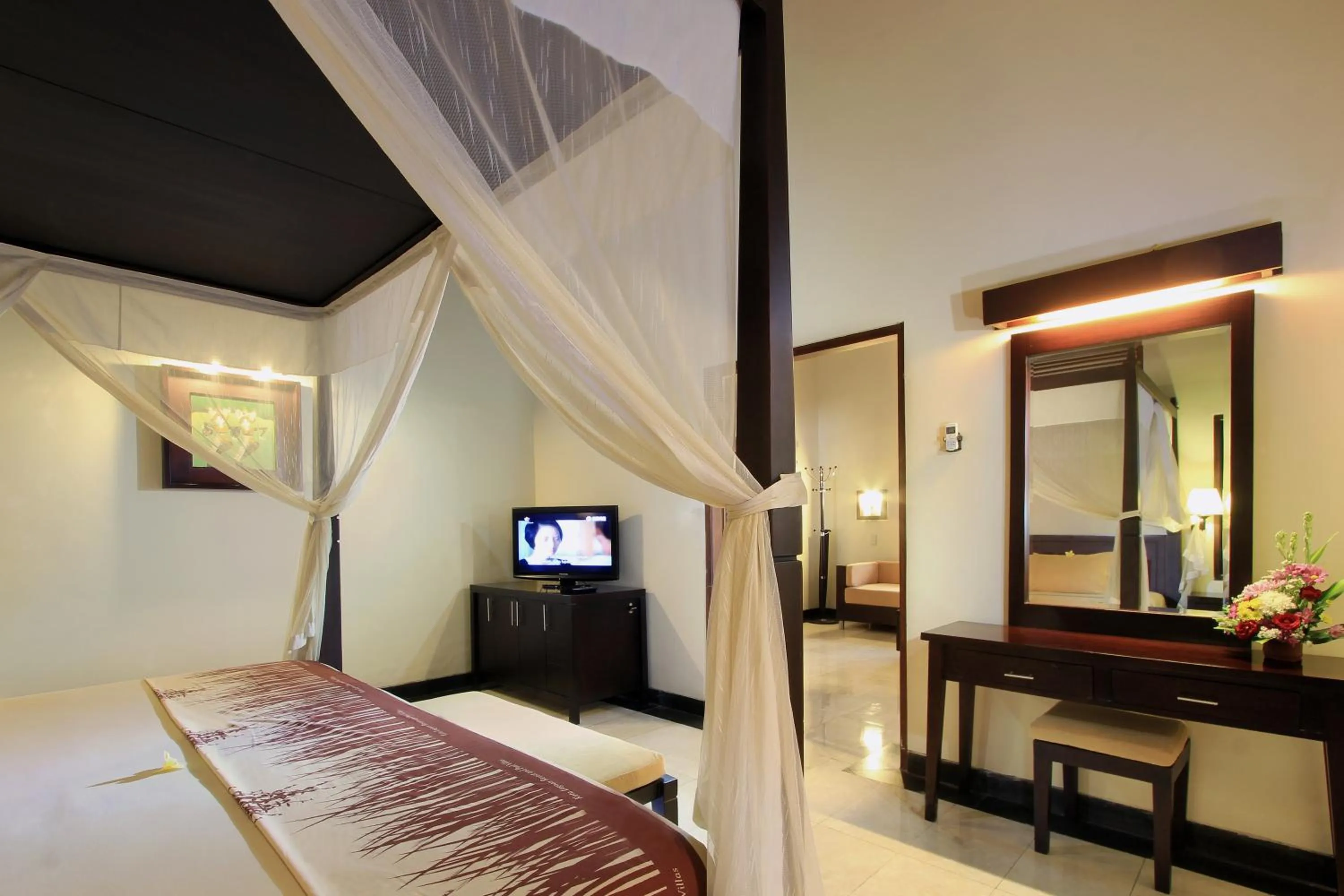 Bed in The Lagoon Bali Pool Hotel and Suites