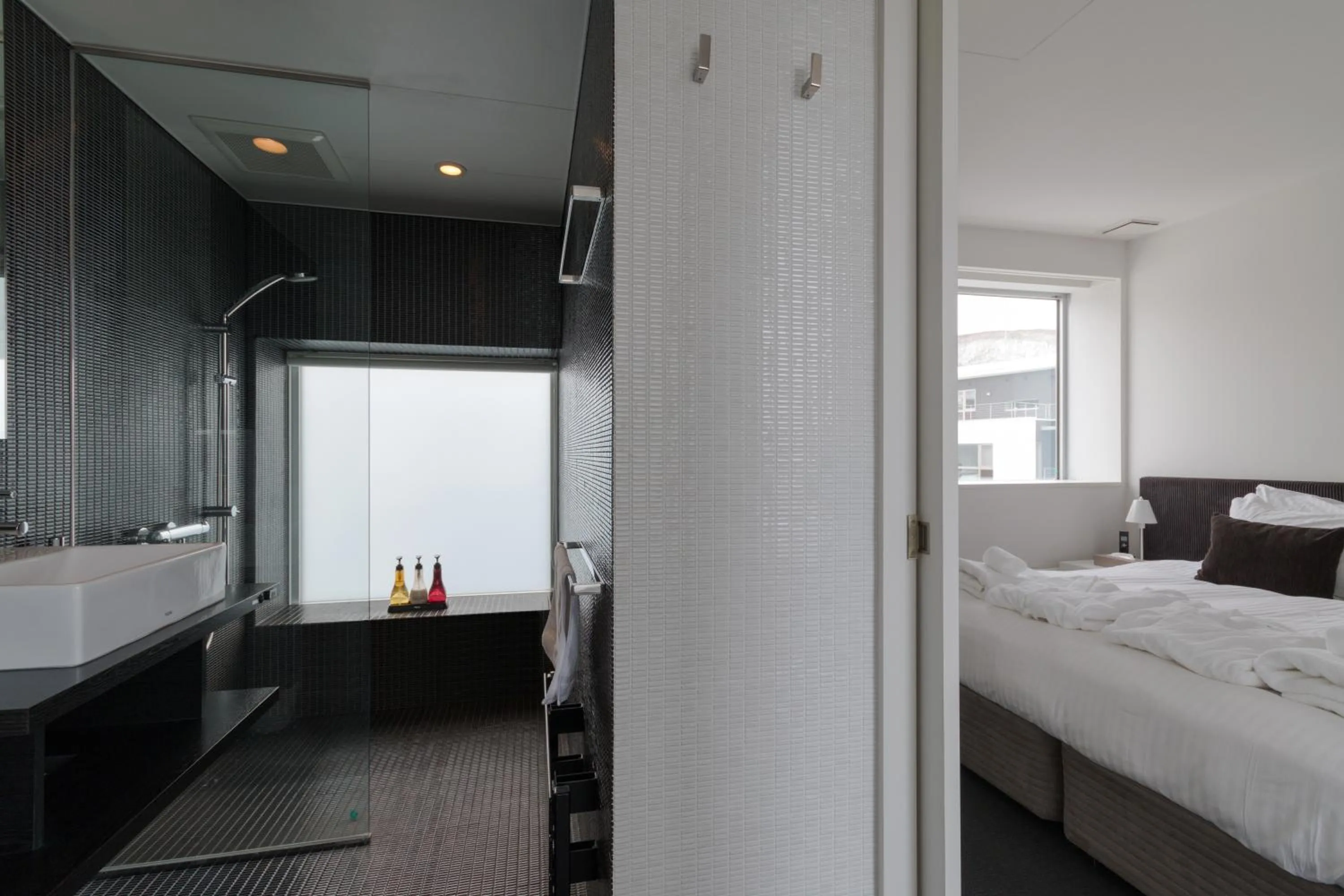 Bathroom, Bed in Kira Kira Suites by H2 Life