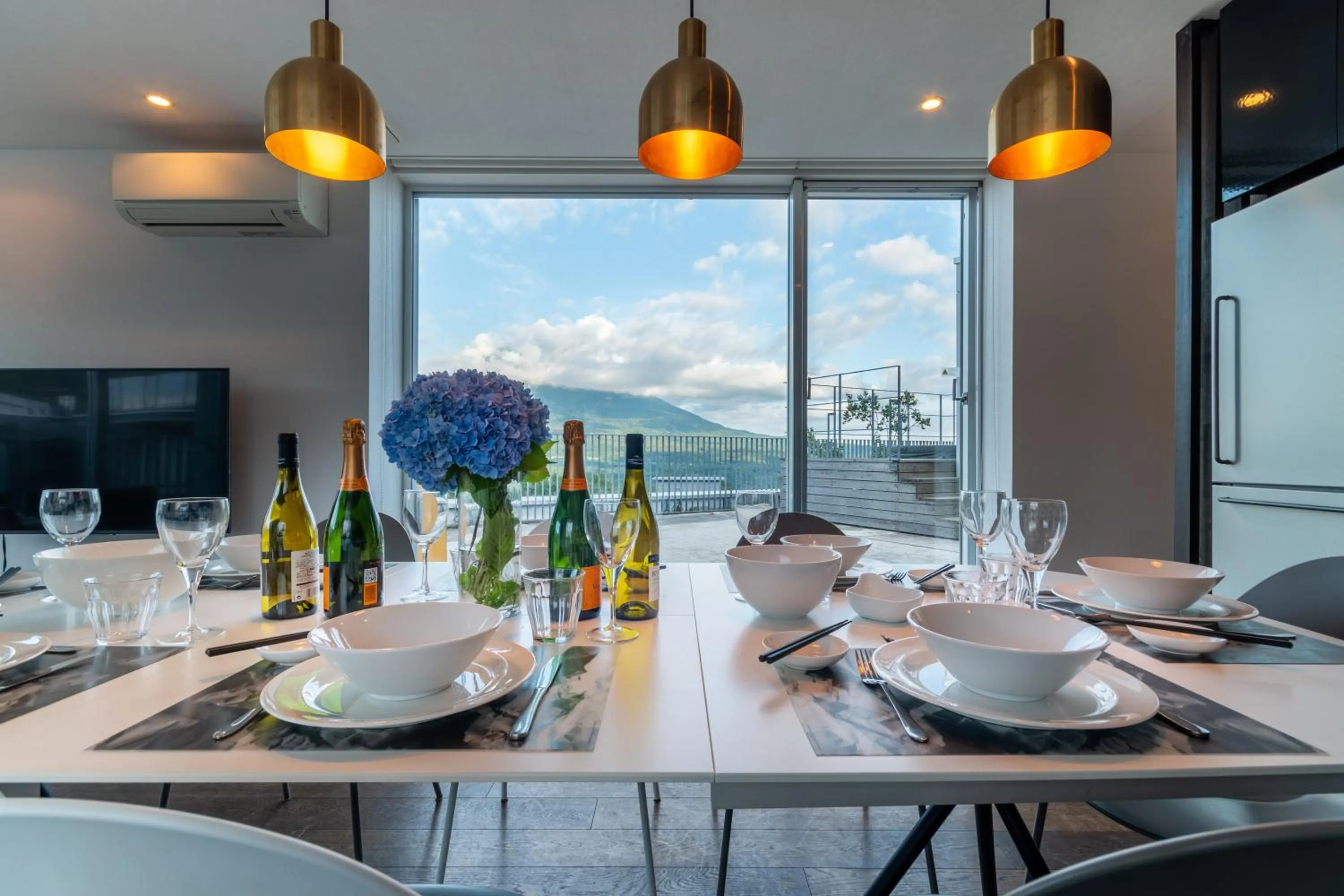 Dining area in Kira Kira Suites by H2 Life