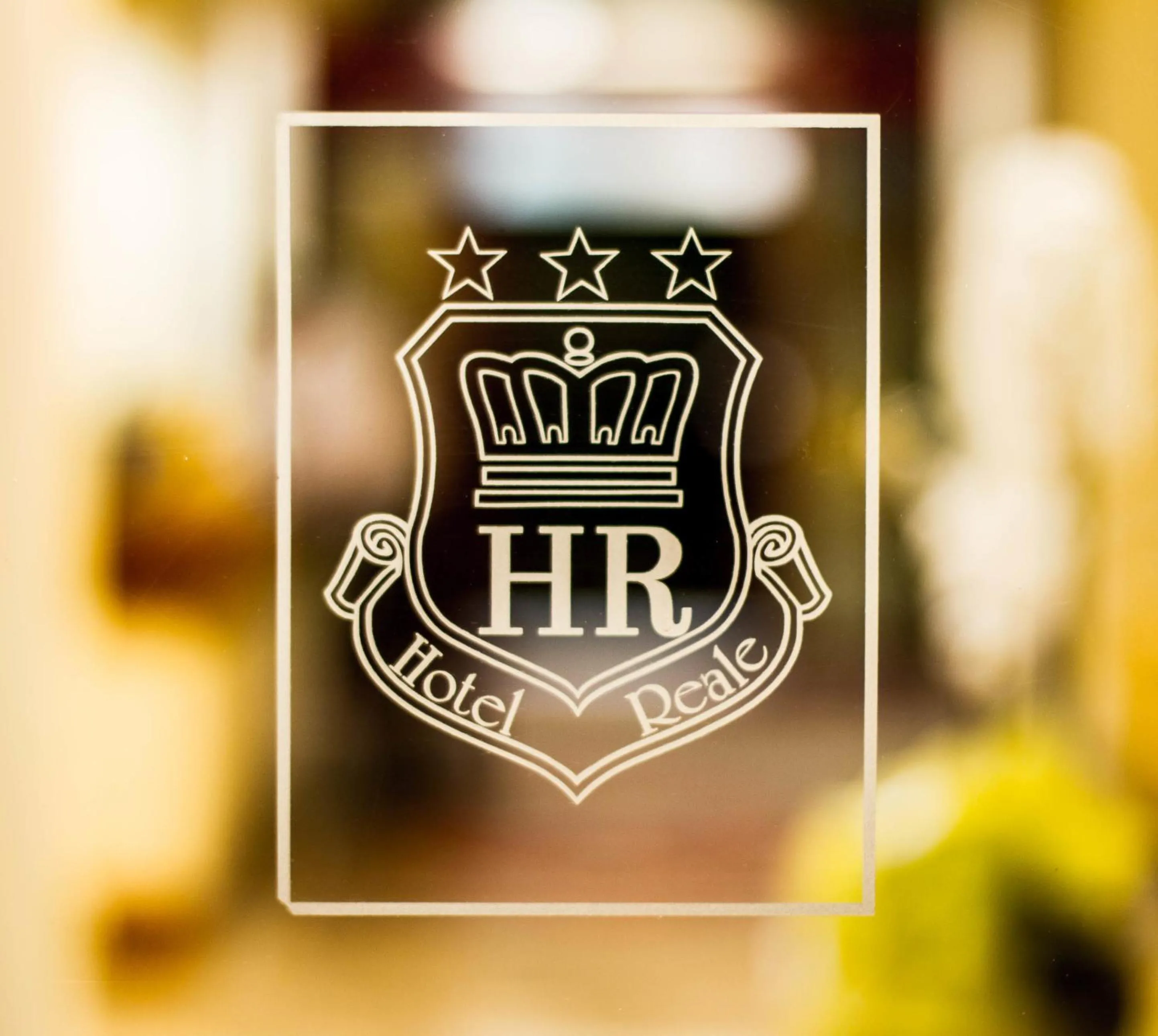 Property logo or sign in Hotel Reale