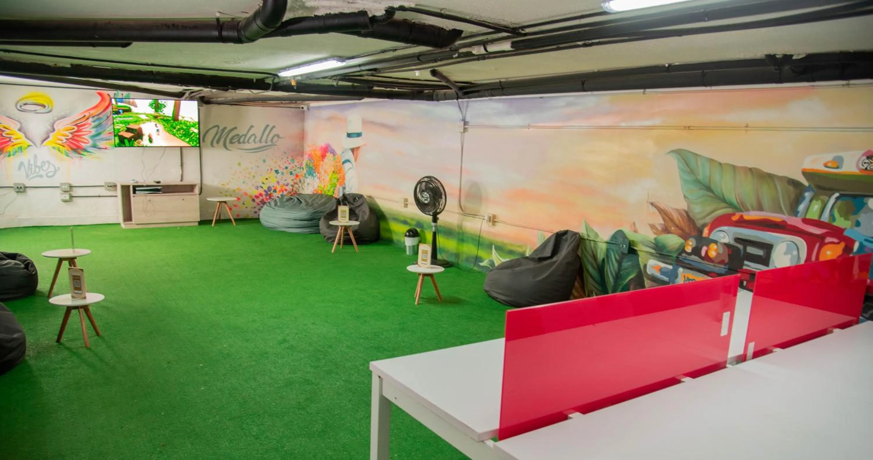 Communal lounge/ TV room in Medellín Vibes Hostel