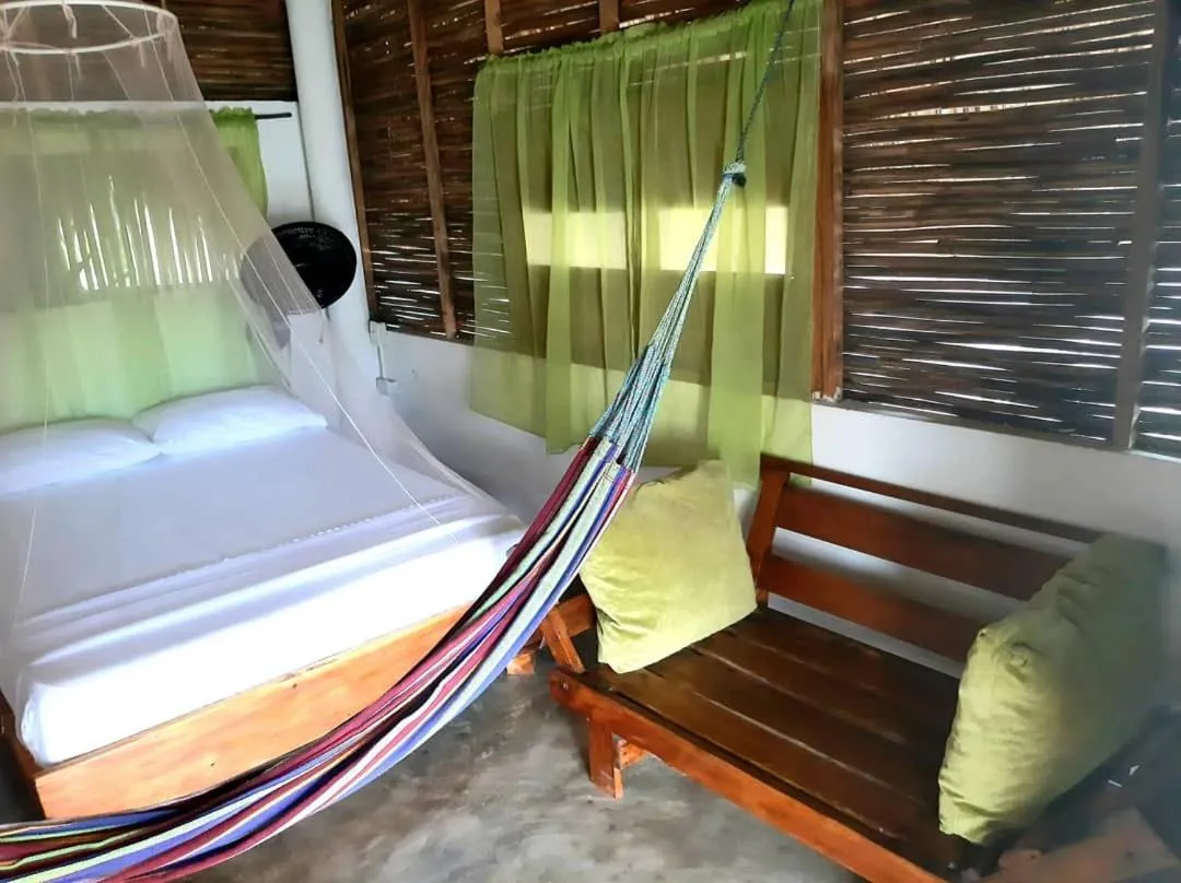 Bed in Ecohotel Kocoluu