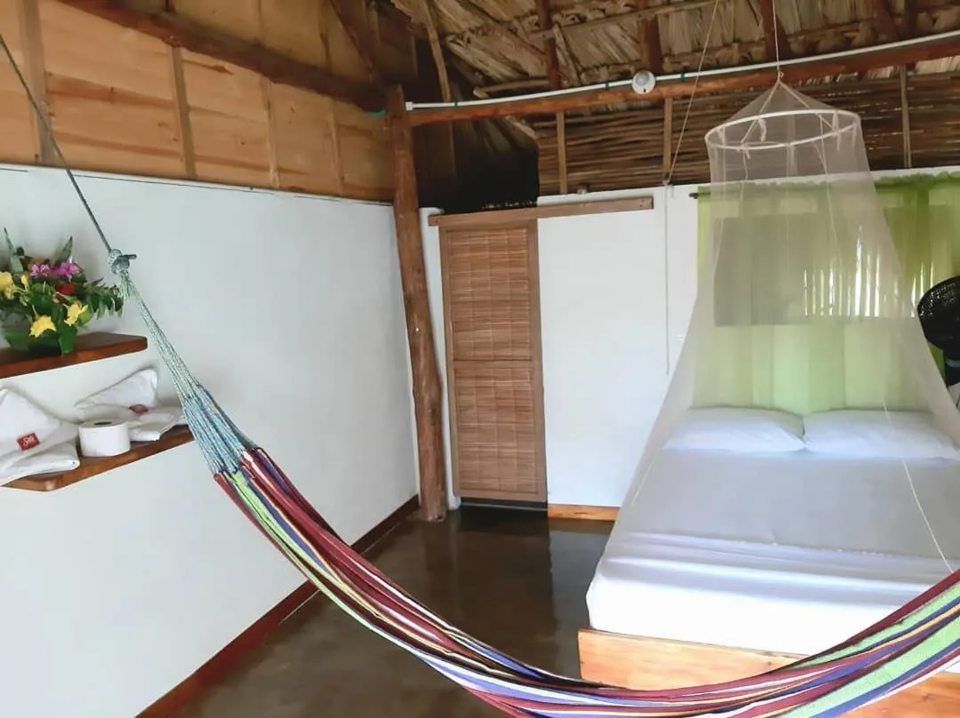 Bed in Ecohotel Kocoluu