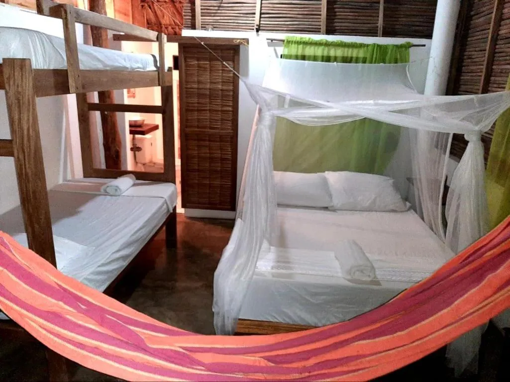 Bed in Ecohotel Kocoluu
