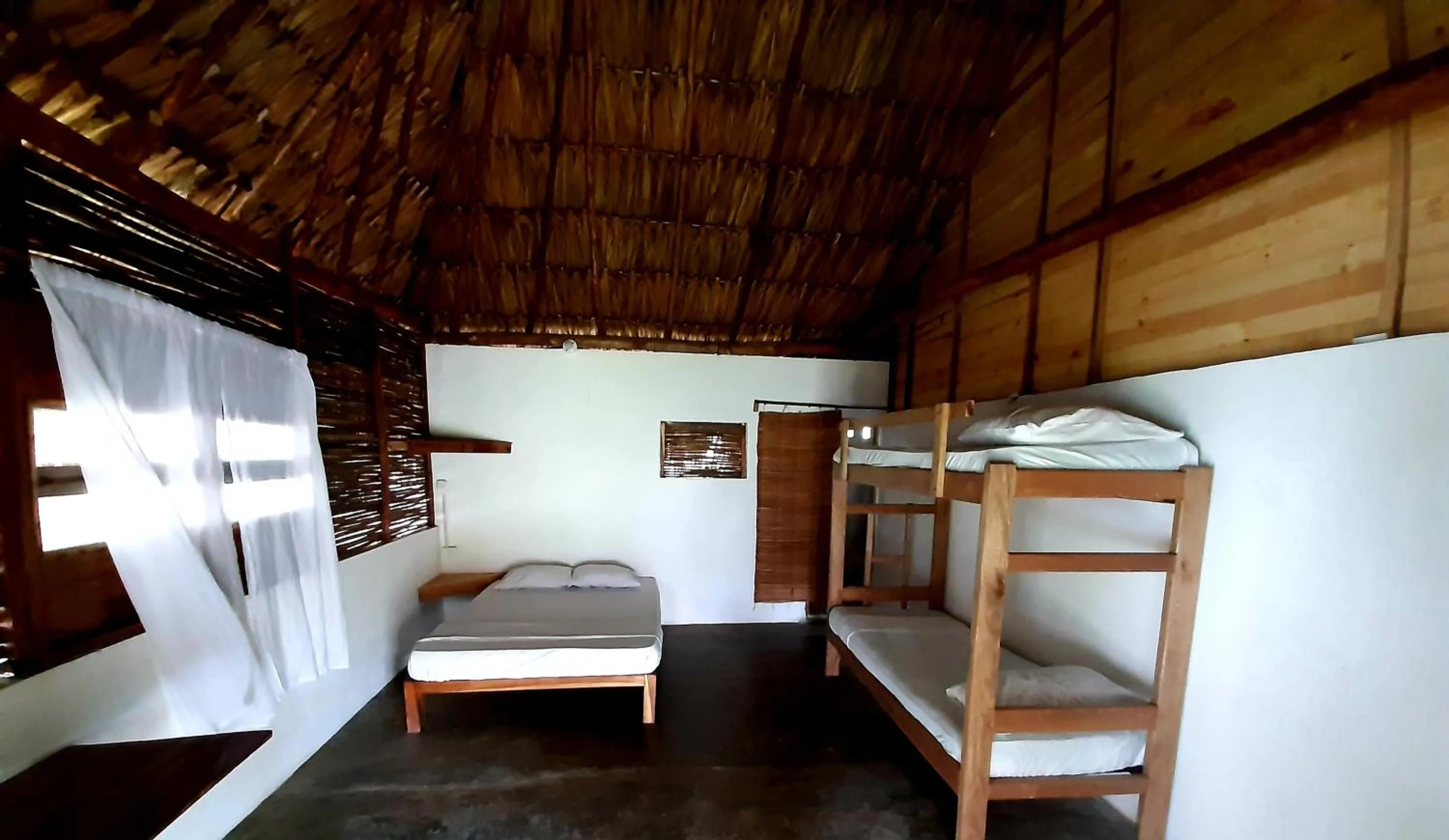 Bed in Ecohotel Kocoluu