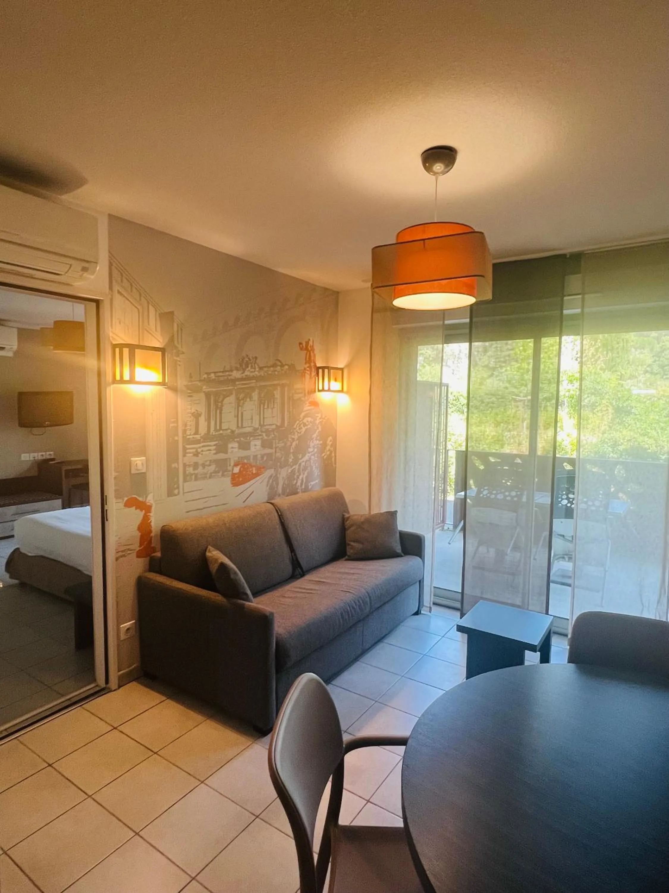 Living room, Bed in Lagrange Aparthotel Montpellier Millénaire