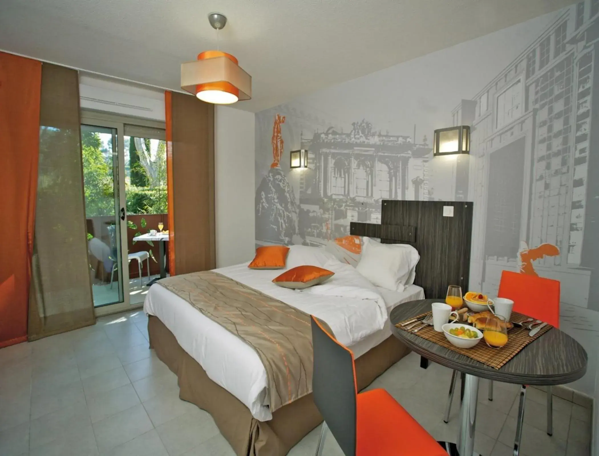 Balcony/Terrace, Bed in Lagrange Aparthotel Montpellier Millénaire Balcony/Terrace, Bed in Lagrange Aparthotel Montpellier Millénaire