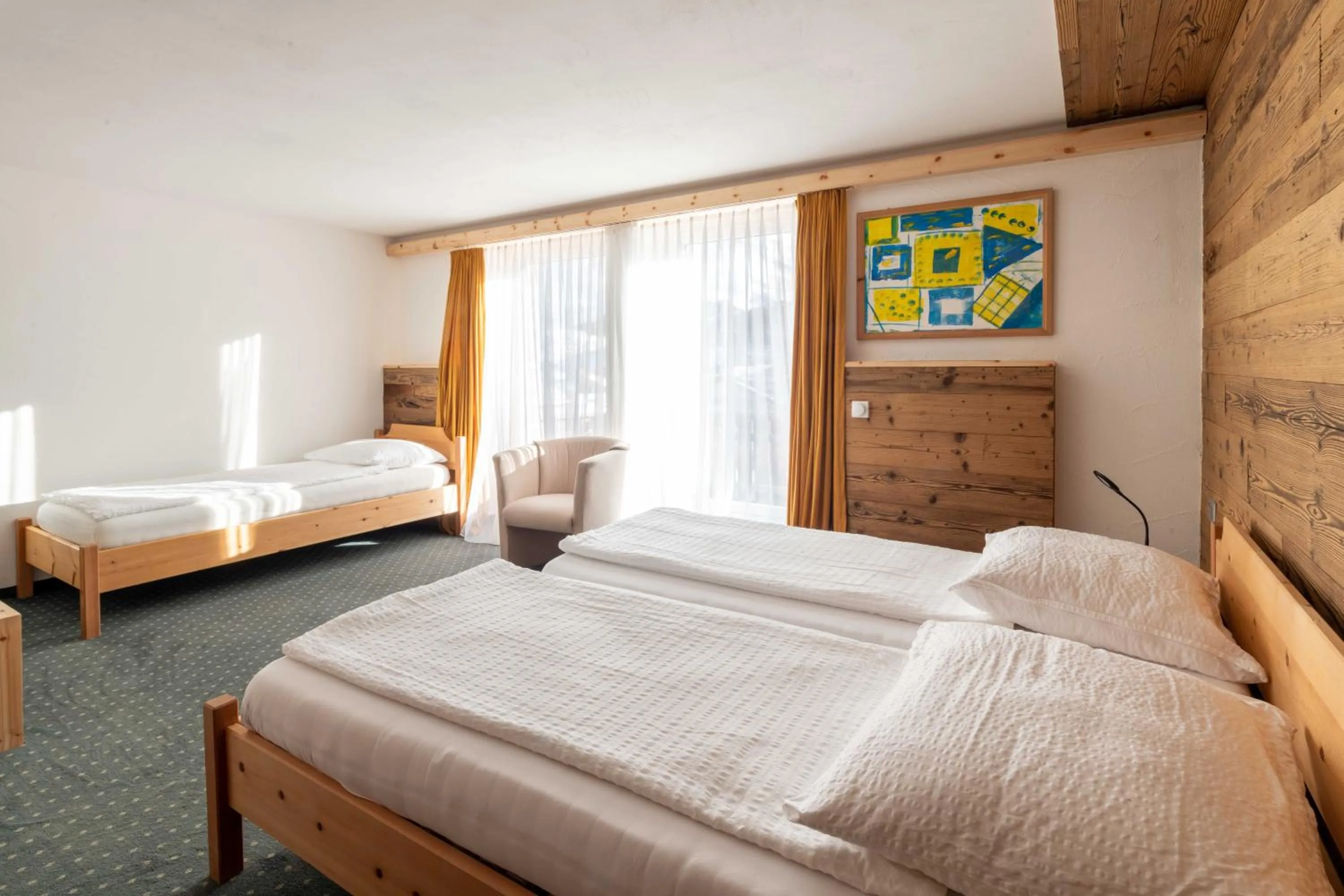 Bed in Hotel Grischuna