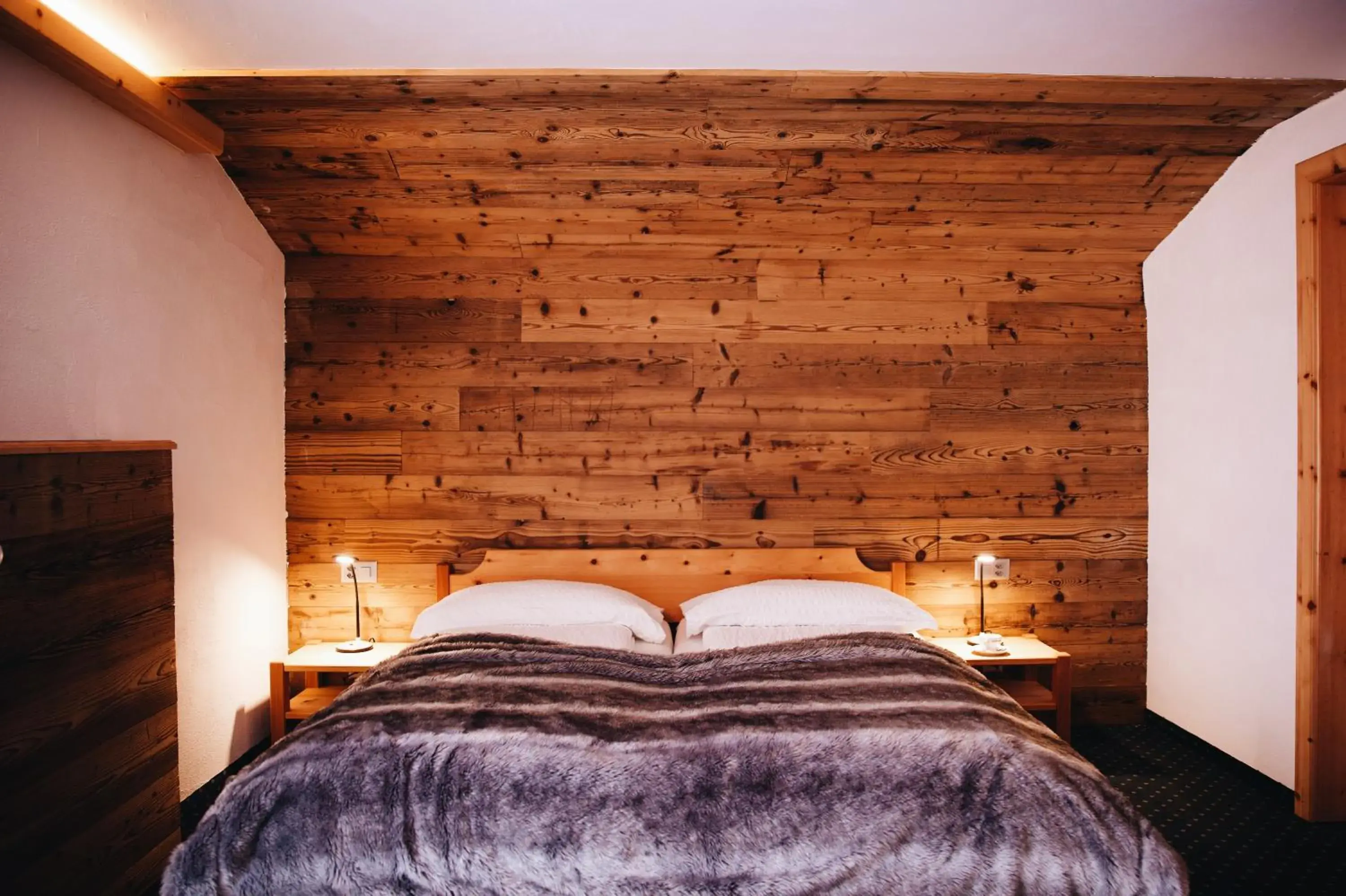 Bed in Hotel Grischuna Bed in Hotel Grischuna