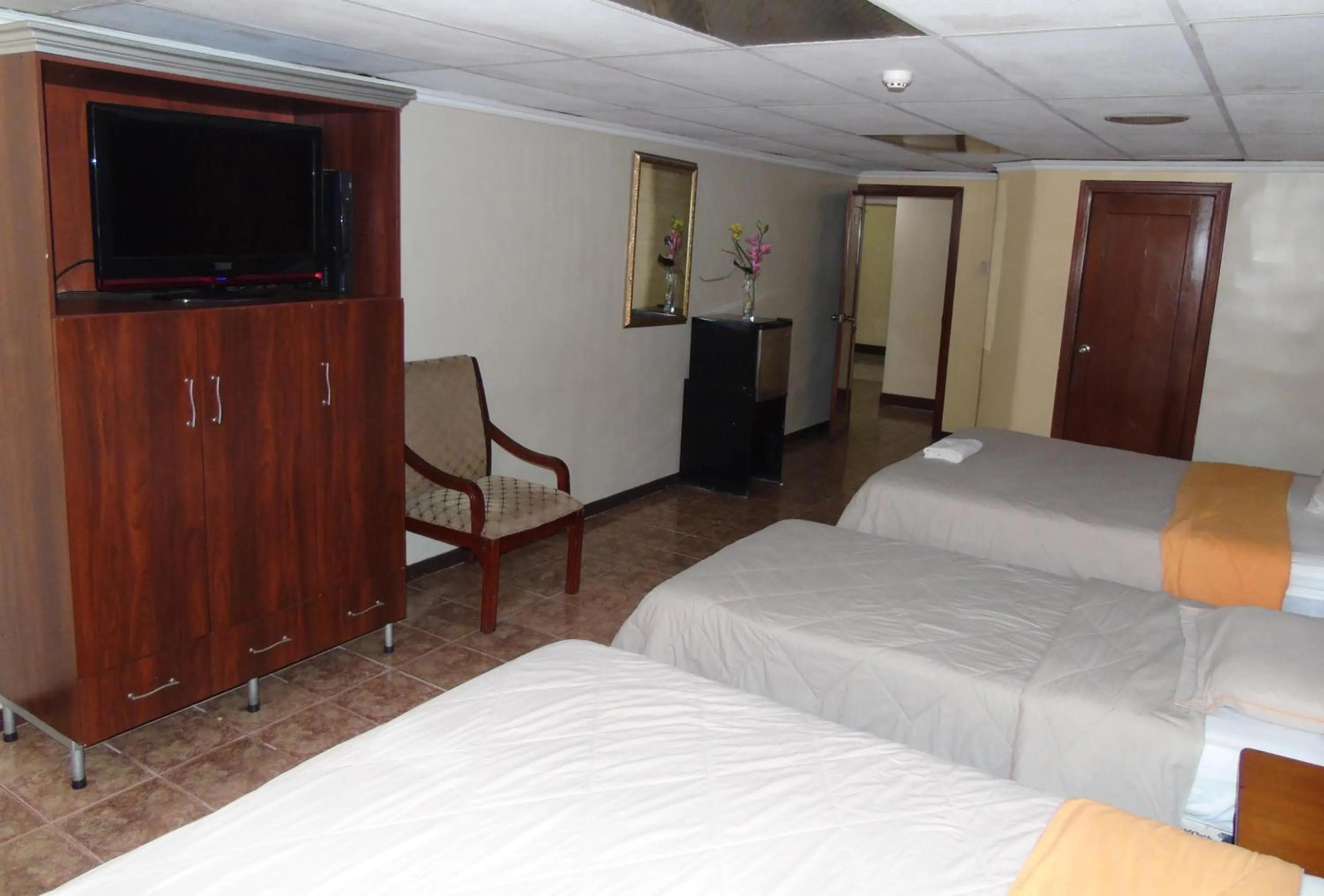 Bed in Hotel Malecon Inn