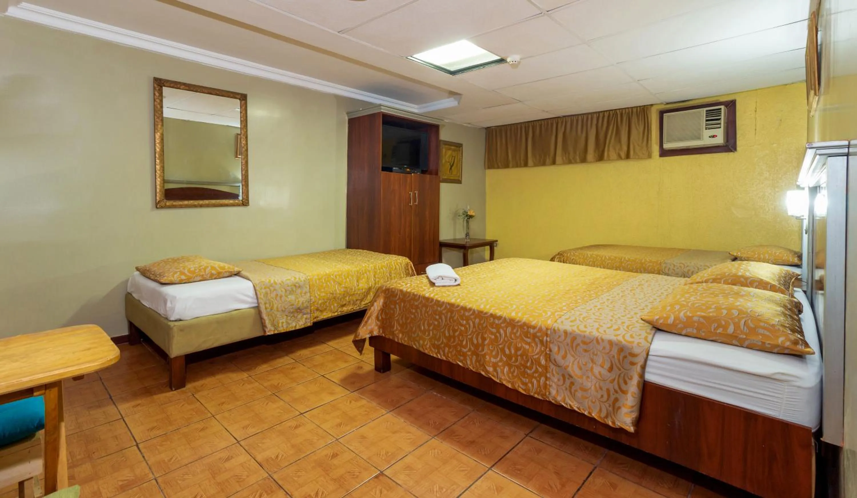 Bed in Hotel Malecon Inn