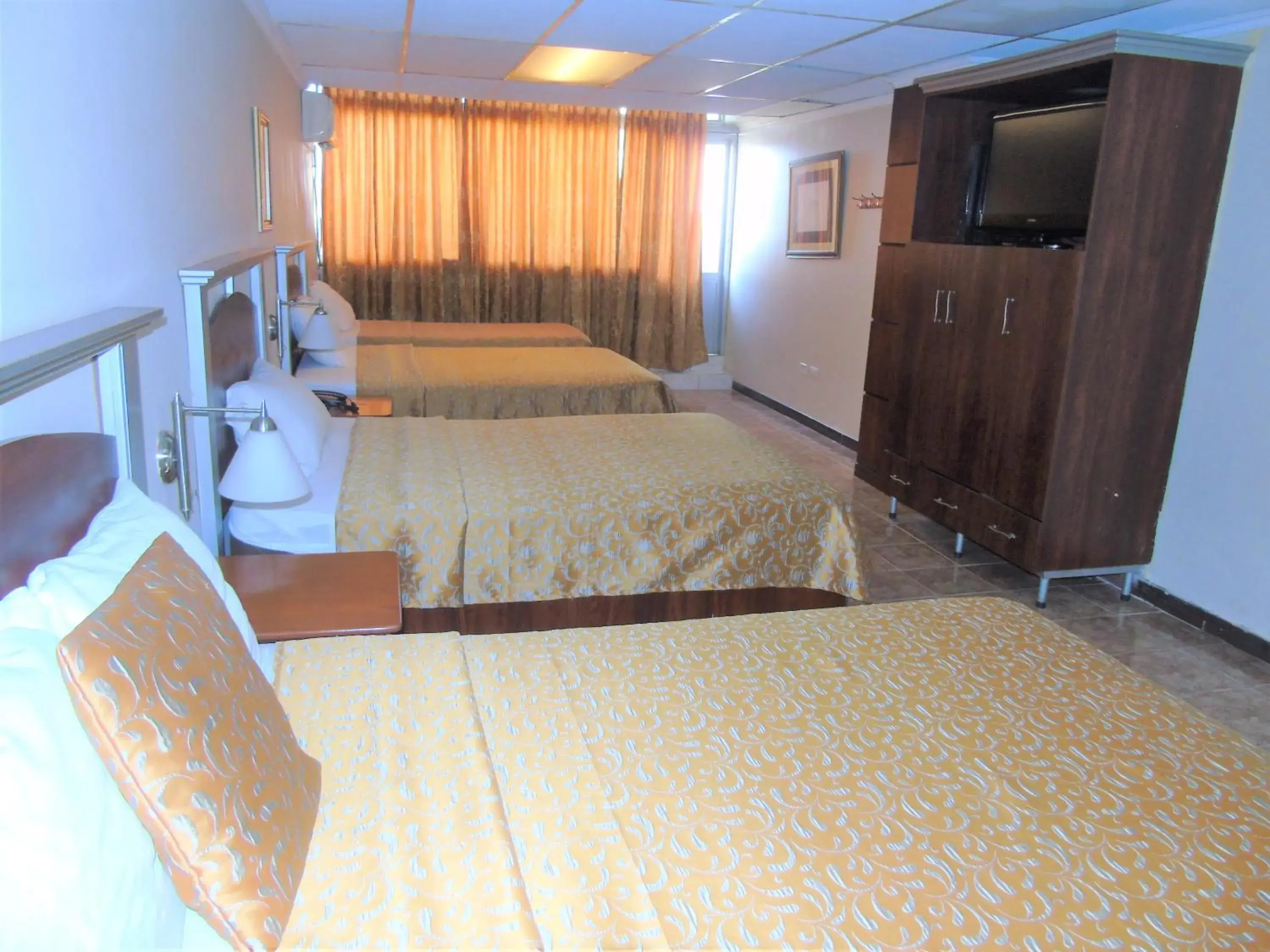 Photo of the whole room, Bed in Hotel Malecon Inn Photo of the whole room, Bed in Hotel Malecon Inn