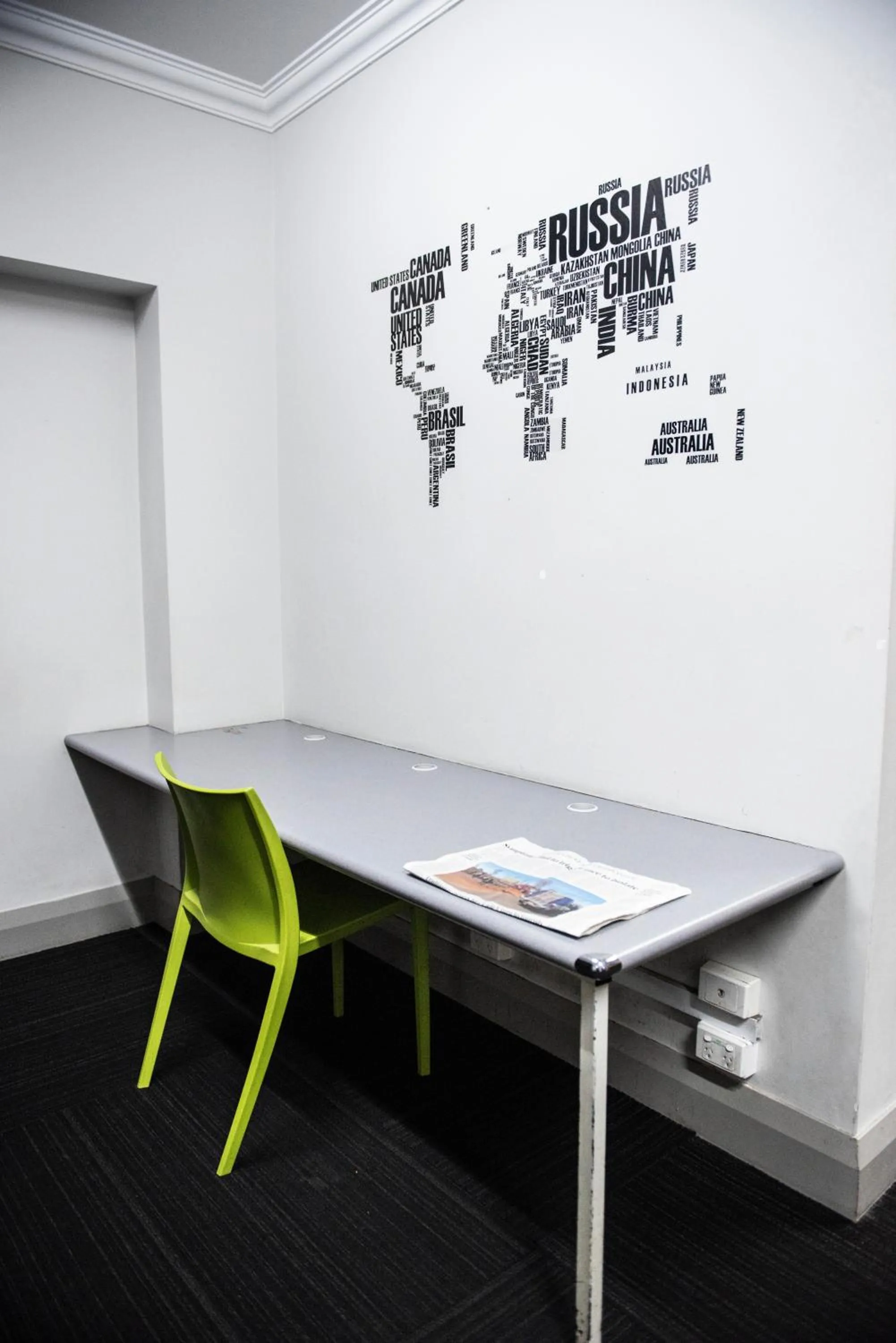 Communal lounge/ TV room in The Emperors Crown Hostel