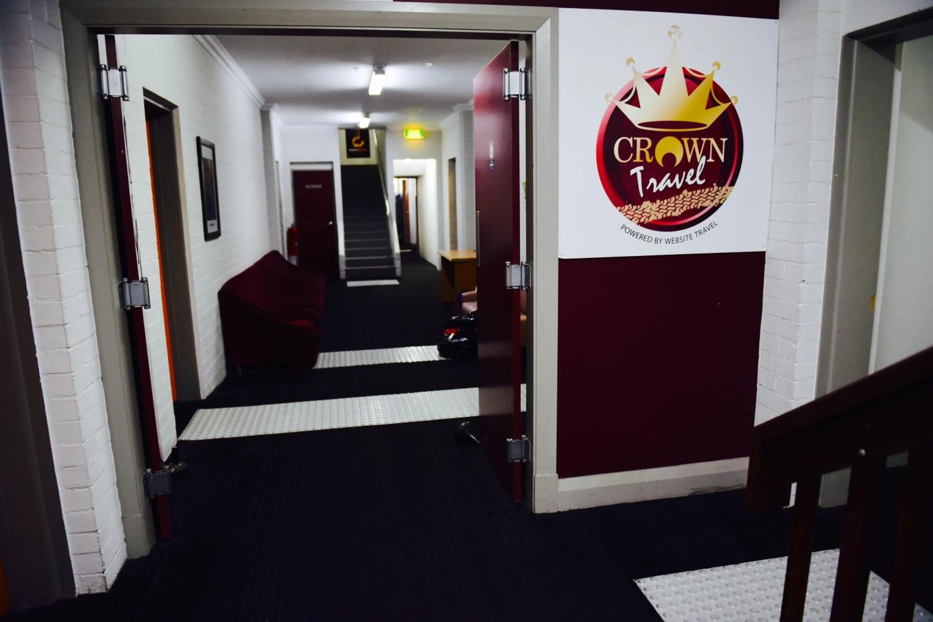 Communal lounge/ TV room in The Emperors Crown Hostel