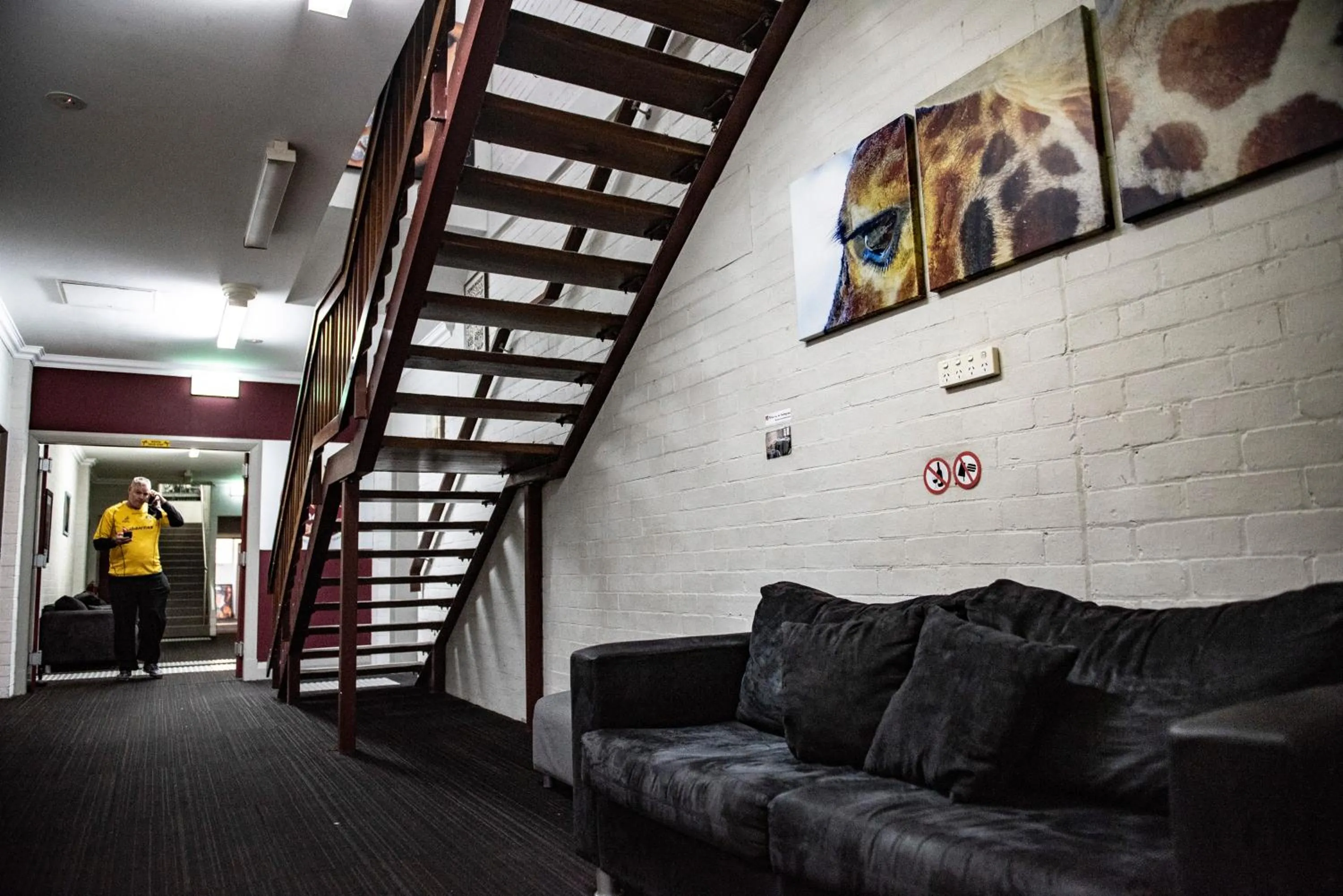 Communal lounge/ TV room in The Emperors Crown Hostel