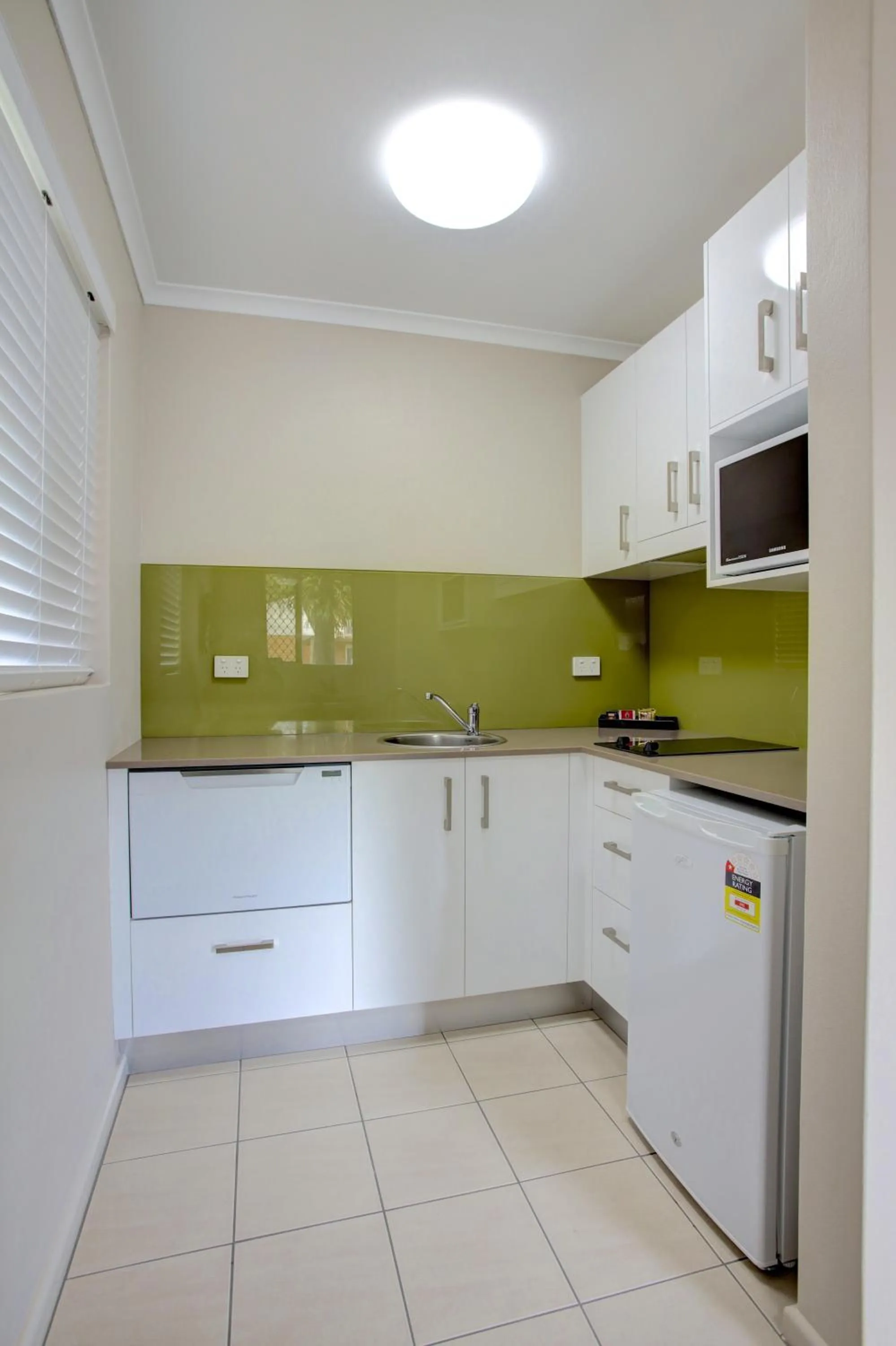 Kitchen or kitchenette in Beachpark Apartments Coffs Harbour