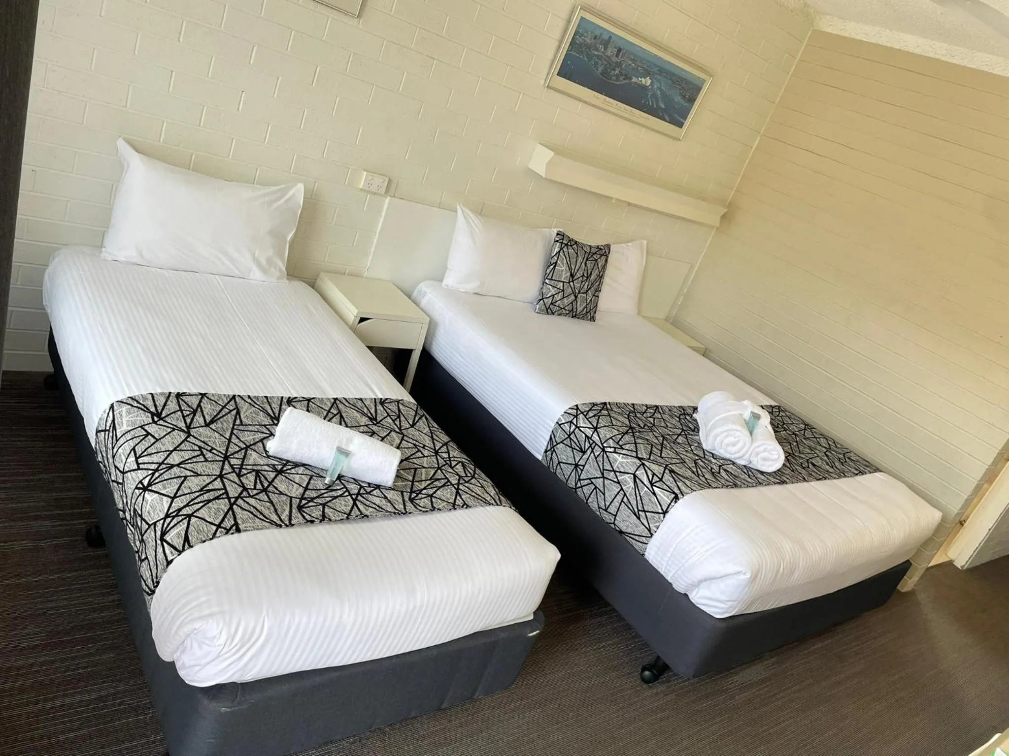 Bed in Coastal Bay Motel