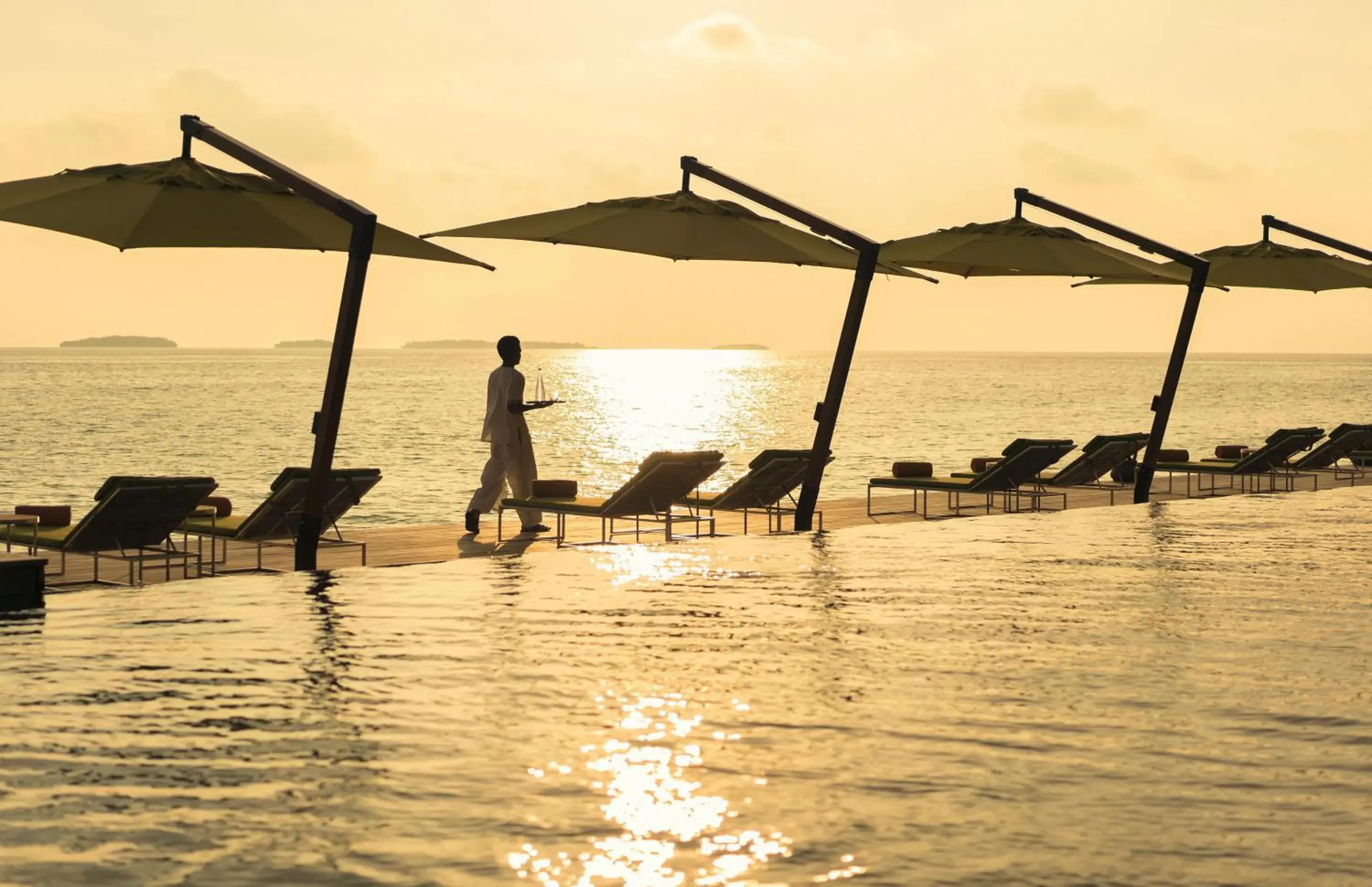 Swimming pool in Anantara Kihavah Maldives Villas Swimming pool in Anantara Kihavah Maldives Villas