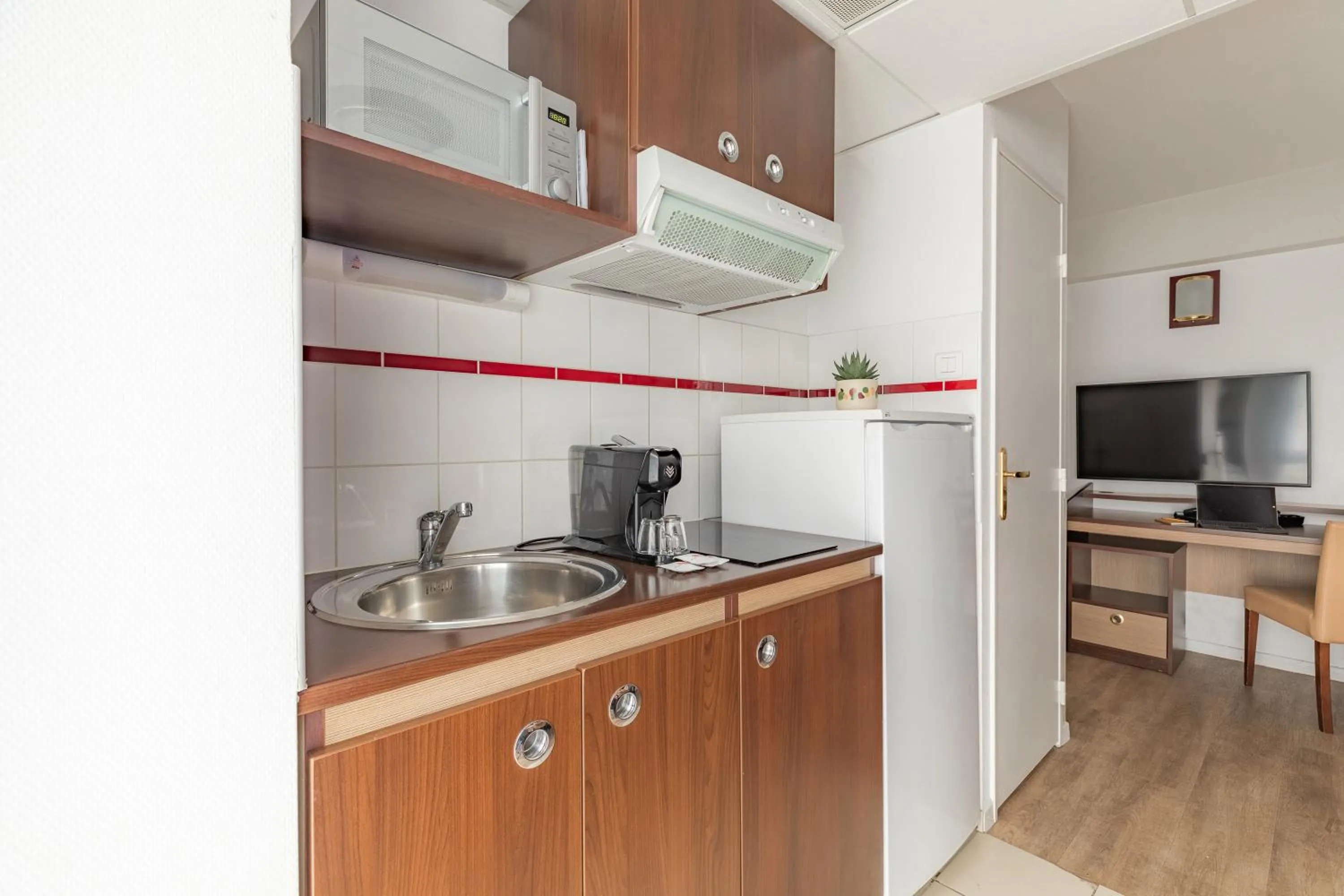Kitchen or kitchenette in Appart'City Confort Pau Centre