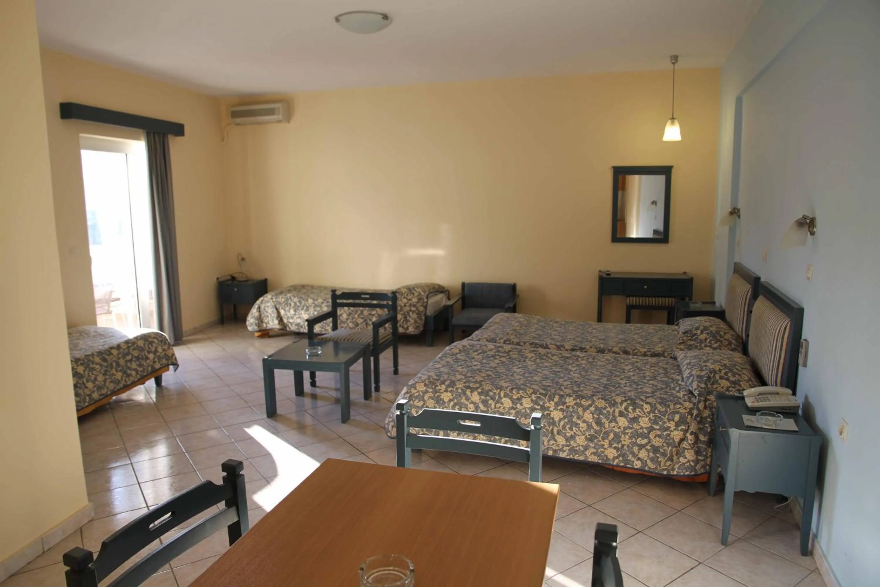 Living room, Bed in Astron Hotel