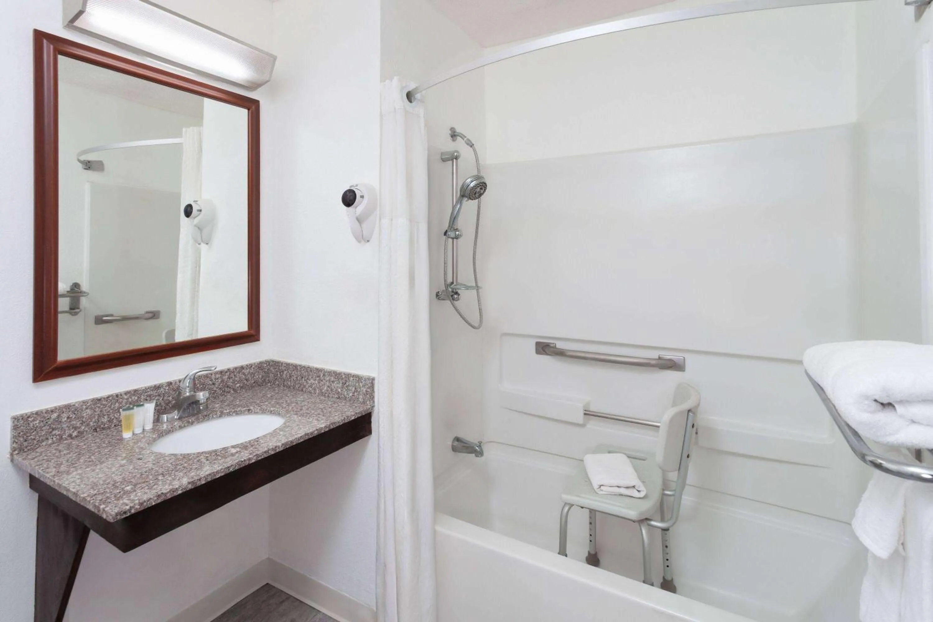 Bathroom in Super 8 by Wyndham Romeoville Bolingbrook