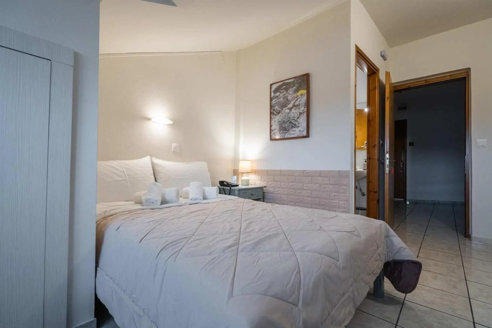 Bed in Olympus View Rooms Sauna & Spa