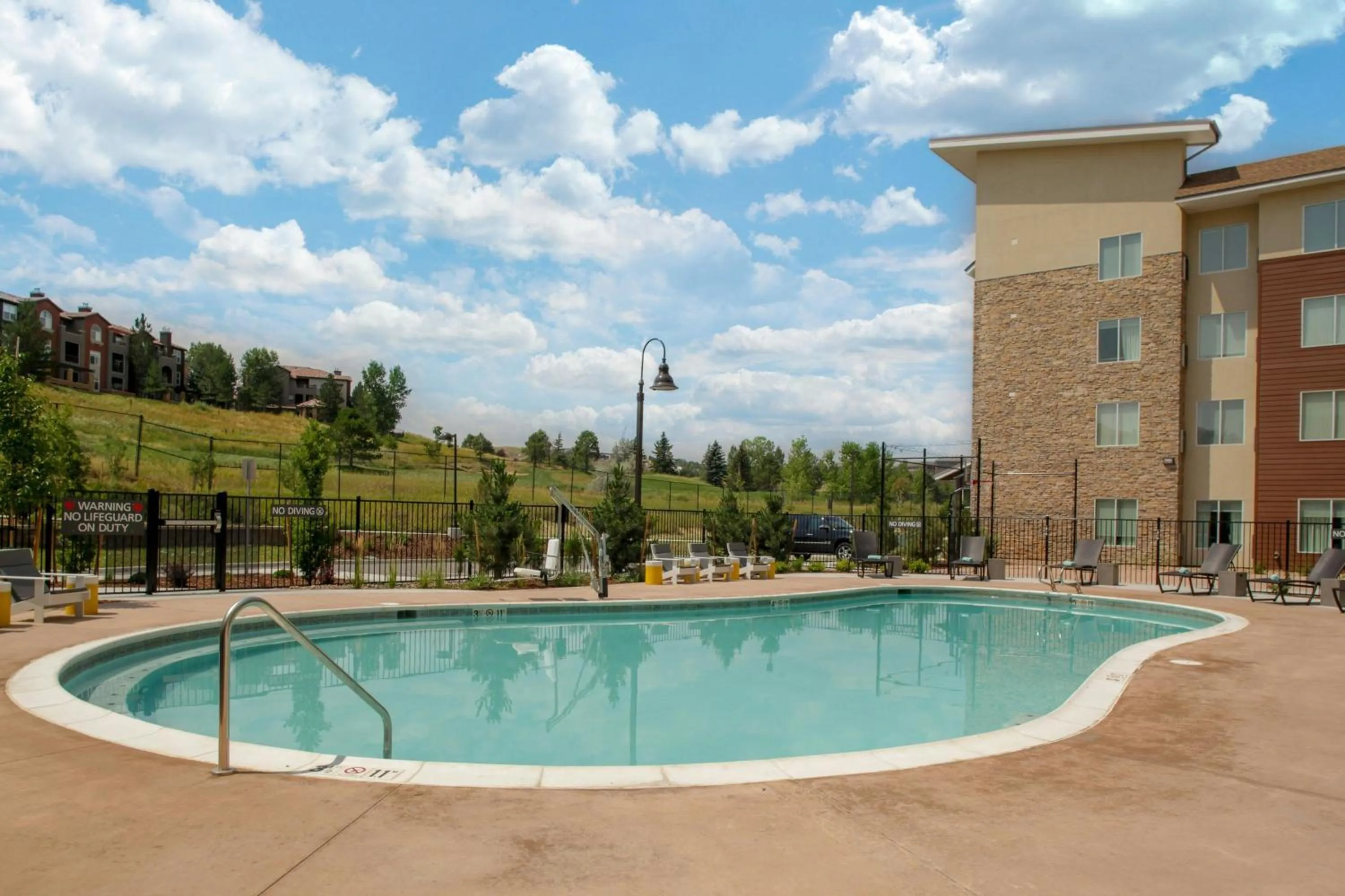 Swimming pool in Fairfield by Marriott Inn and Suites Boulder Broomfield Interlocken