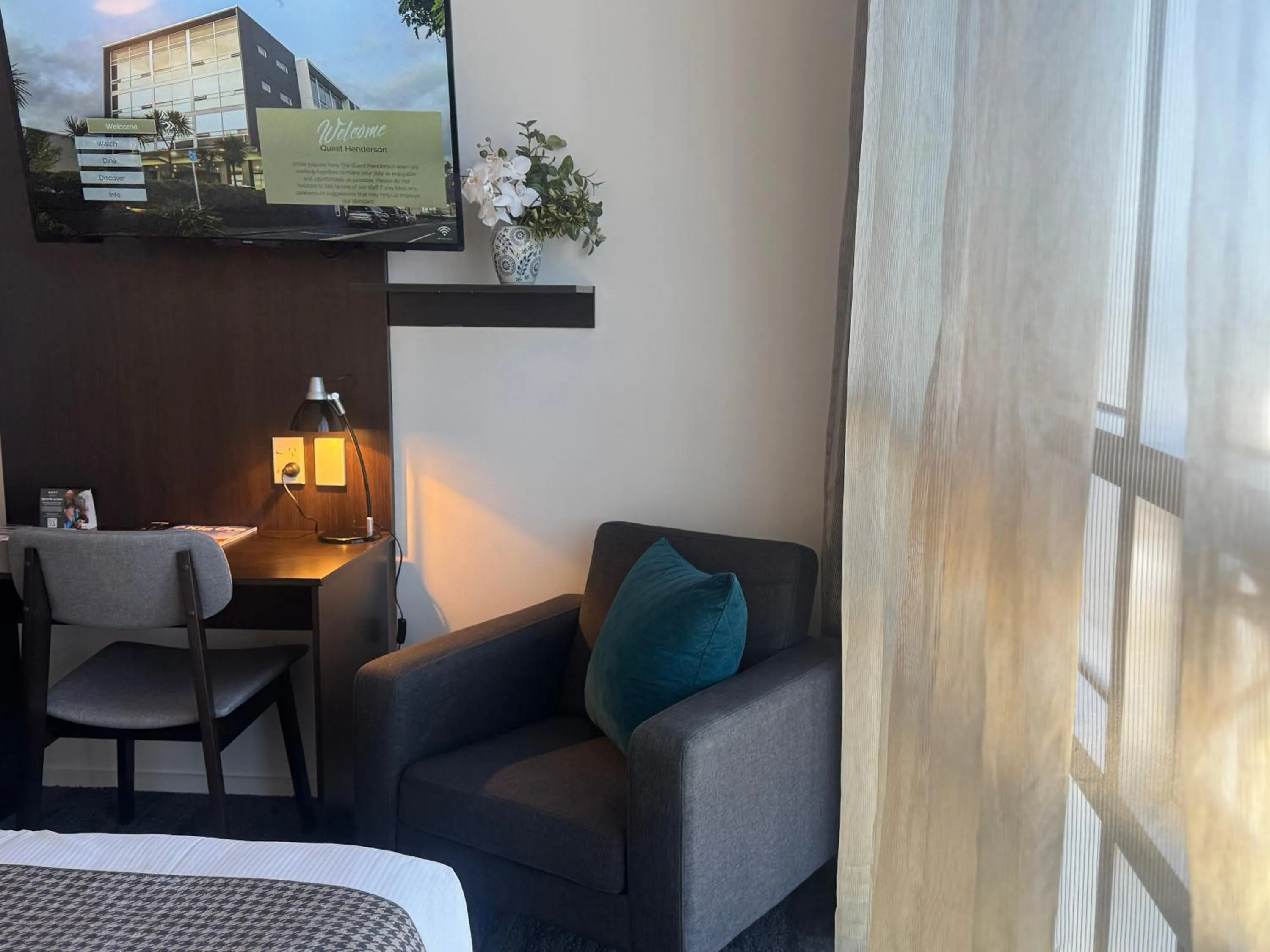 Seating area in Quest Henderson, Auckland Apartment Hotel