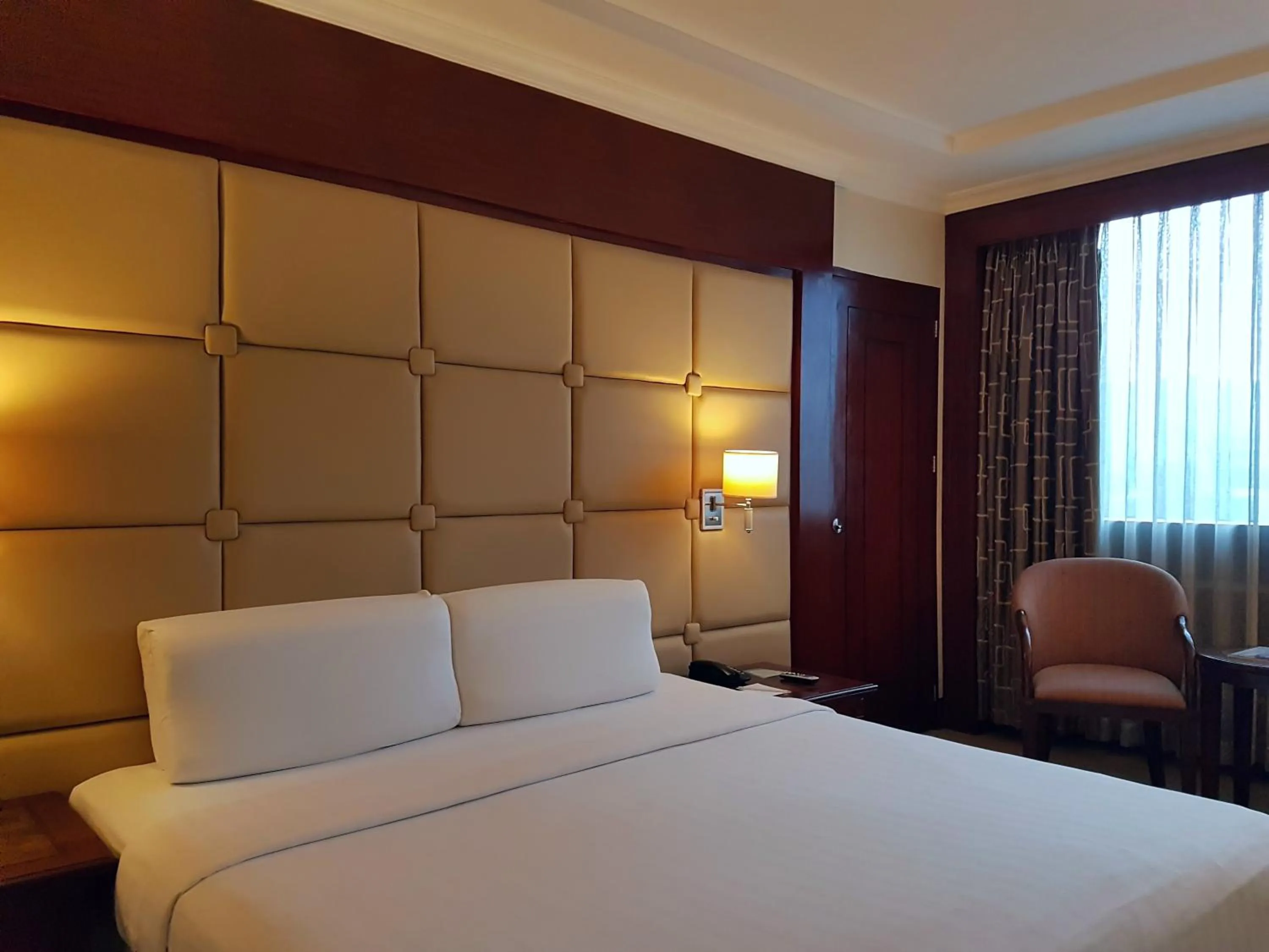 Bed in Cebu Parklane International Hotel