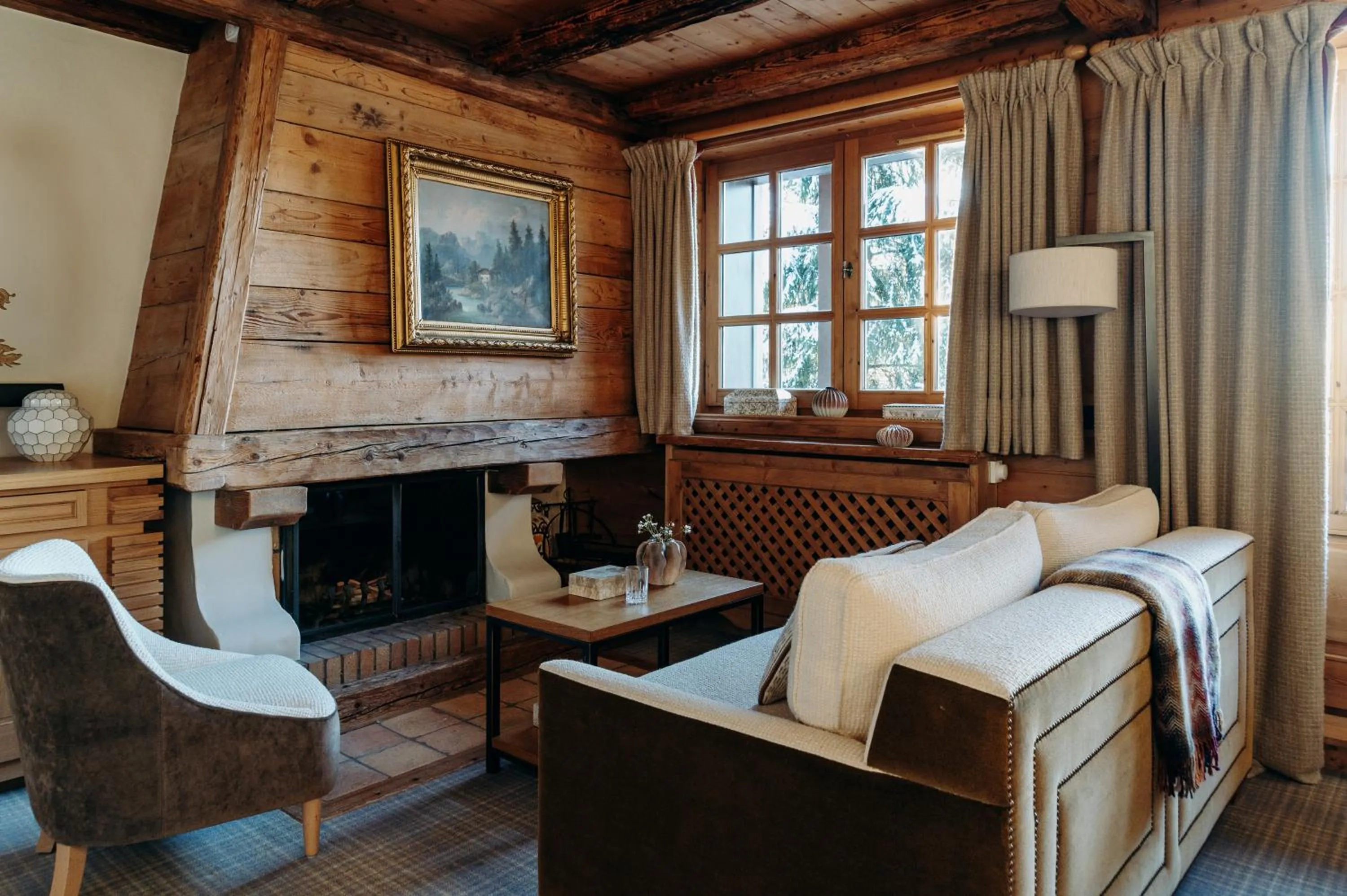 fireplace, Bed in Les Chalets du Mont d'Arbois & Spa, Megève