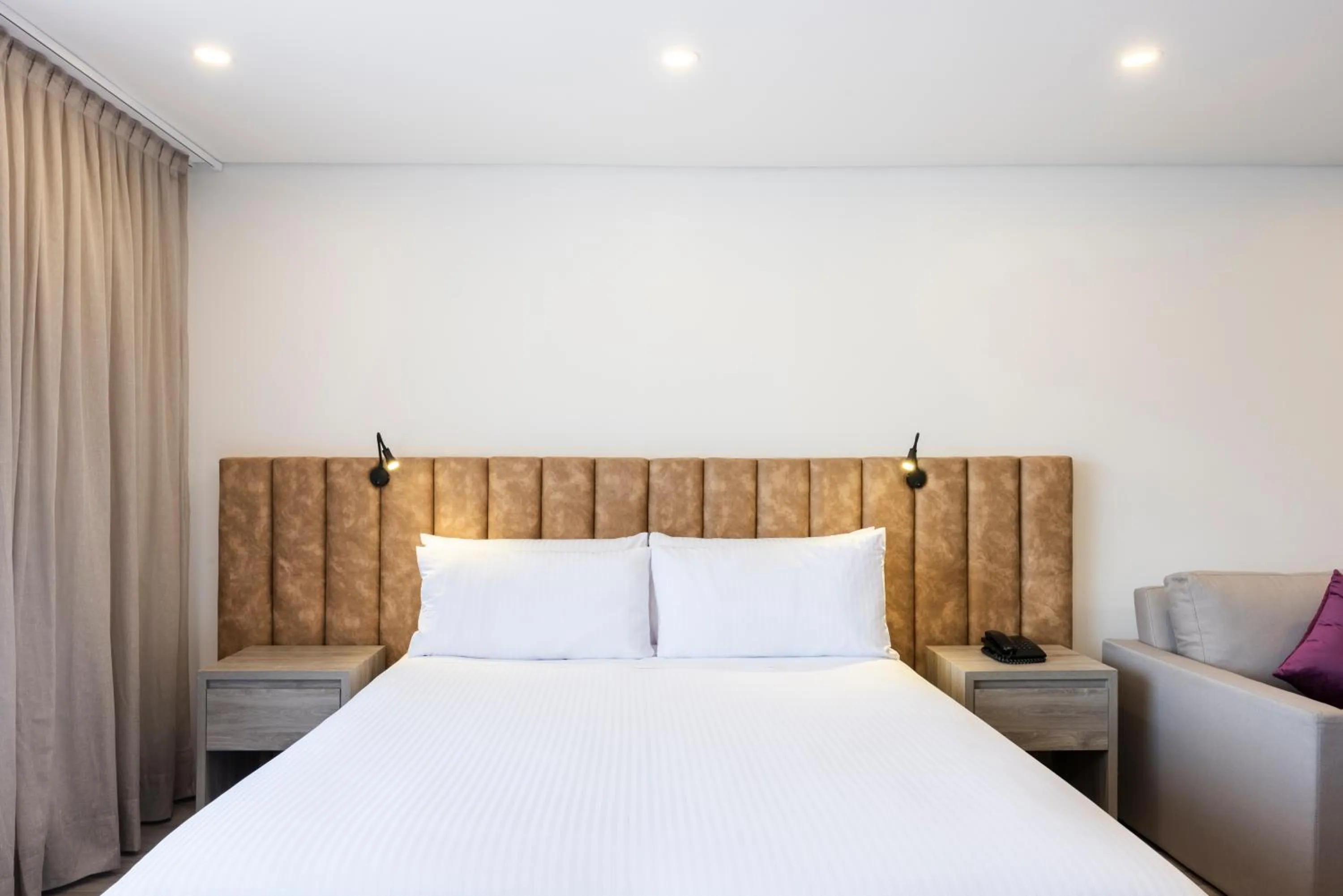 Bed in Hotel Jazz Apartments