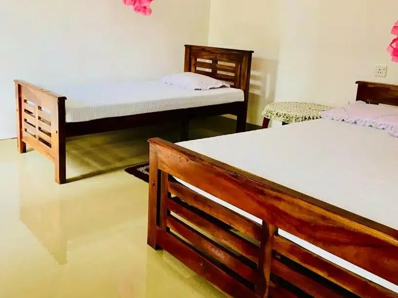 Bed in Kumari Guest House
