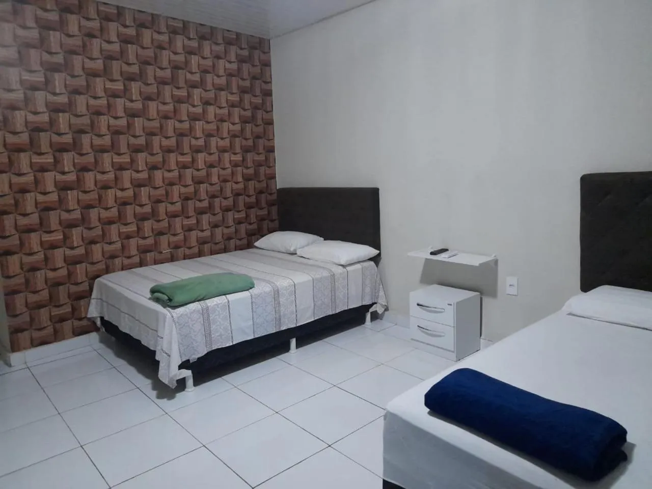 Bed in Pousada e Posto Amigão