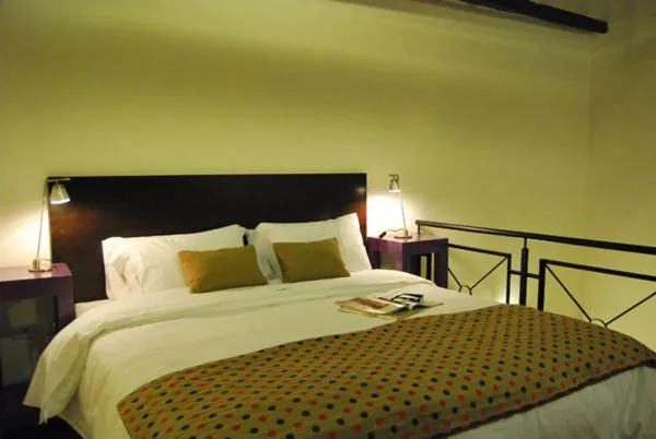 Bed in La Rozada Suites