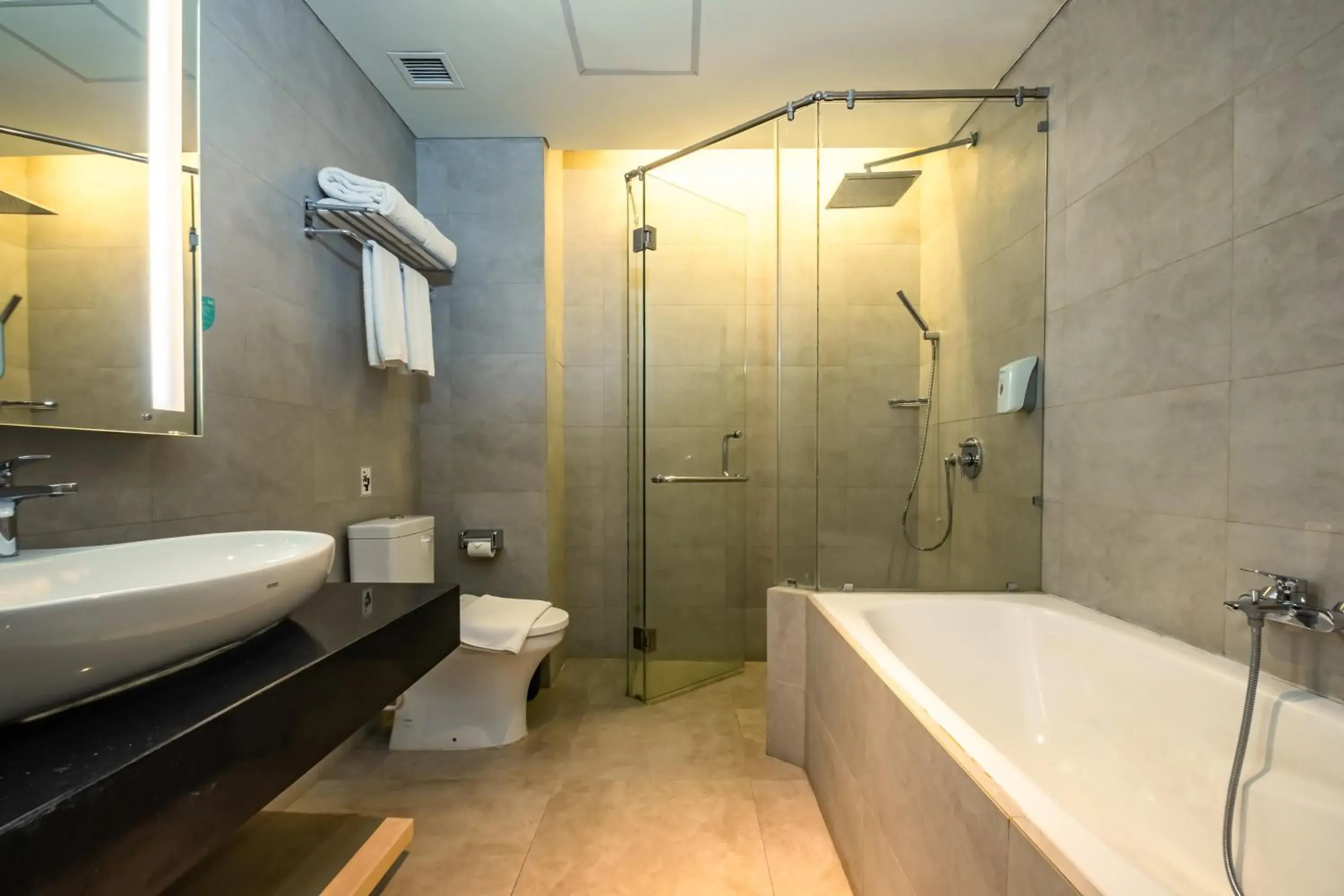 Bathroom in Hotel AYOLA Lippo Cikarang Bathroom in Hotel AYOLA Lippo Cikarang