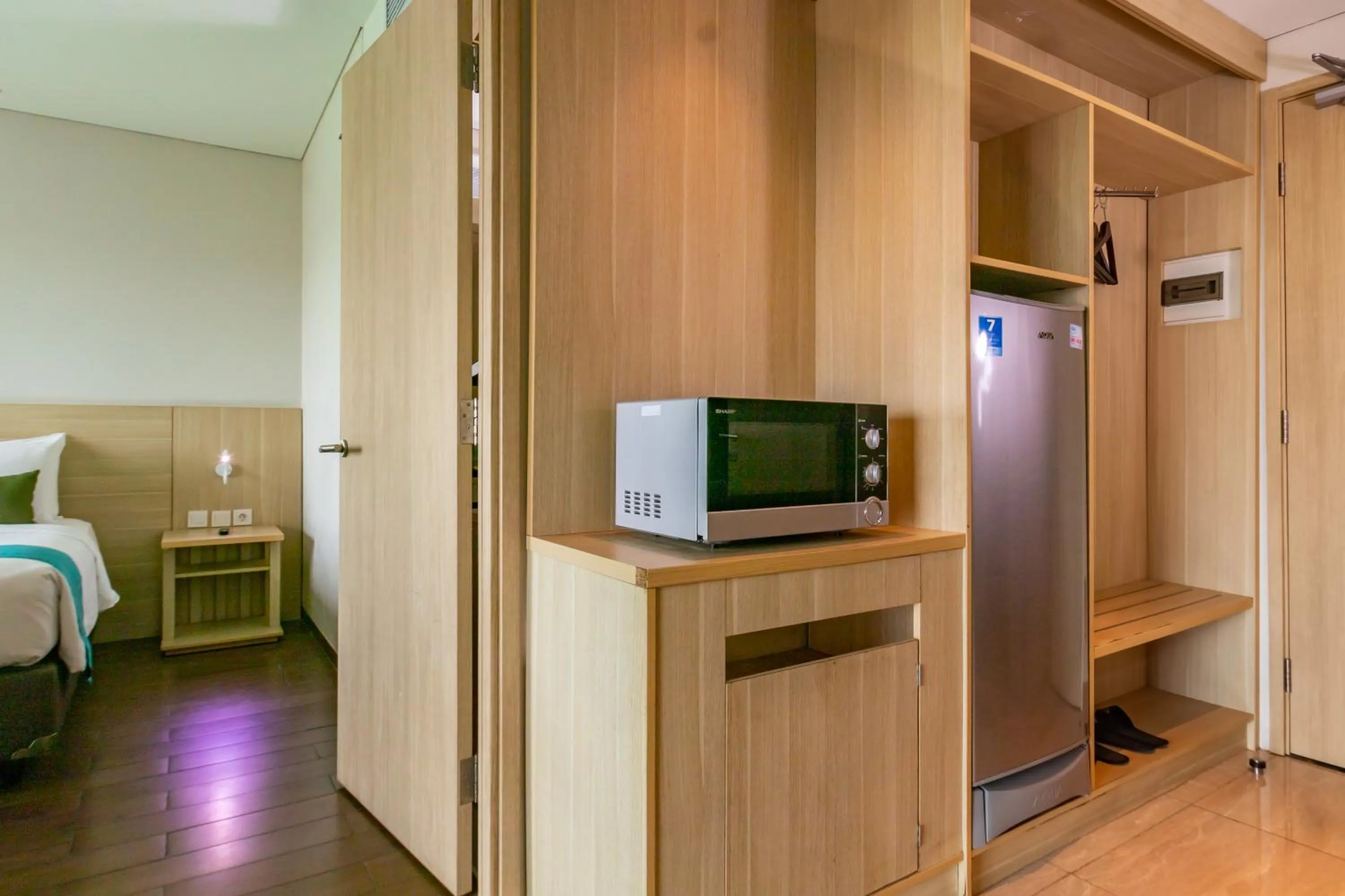 Living room, Bed in Hotel AYOLA Lippo Cikarang