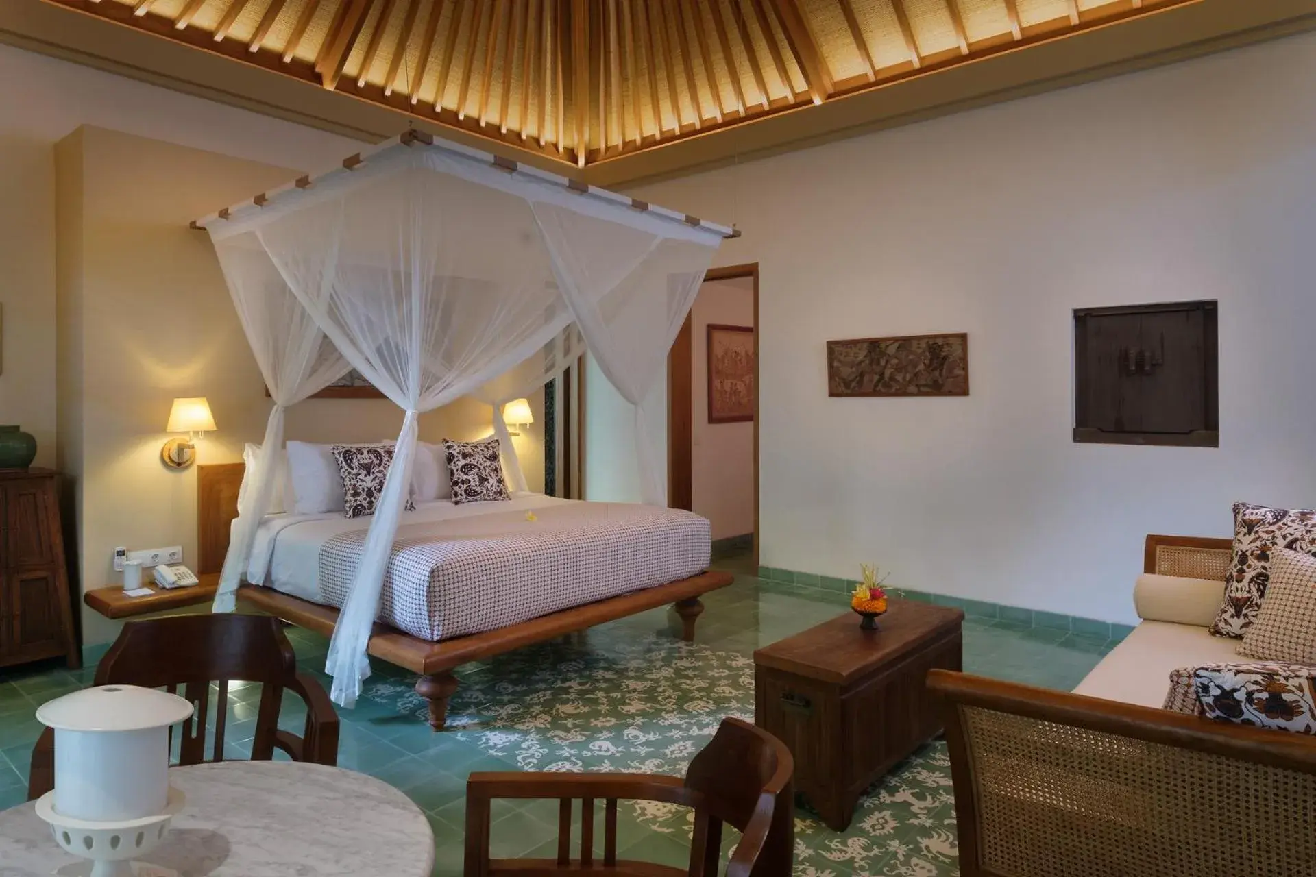 Seating area, Bed in Tandjung Sari Hotel Seating area, Bed in Tandjung Sari Hotel