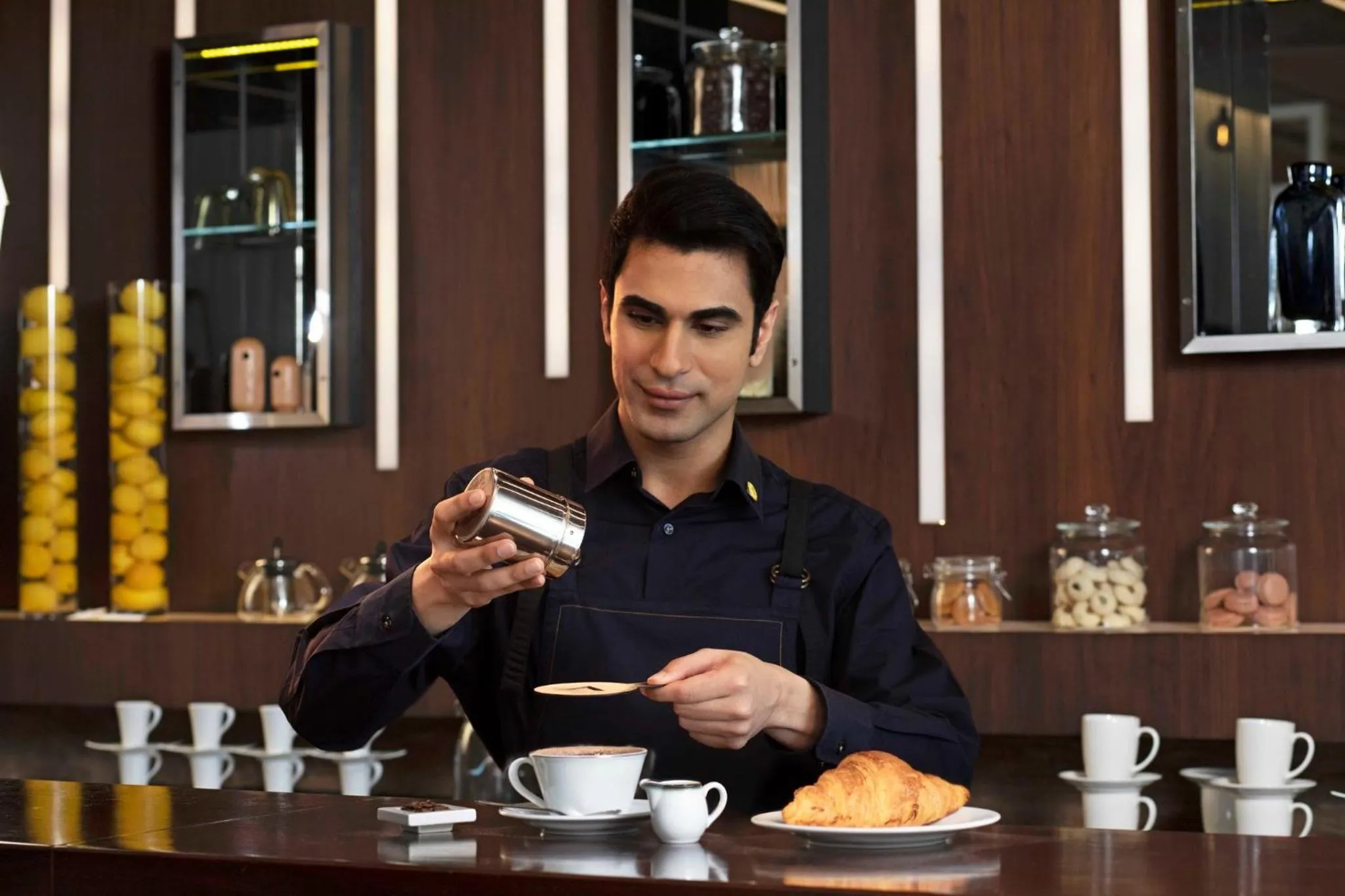 Lounge or bar in voco Dubai by IHG